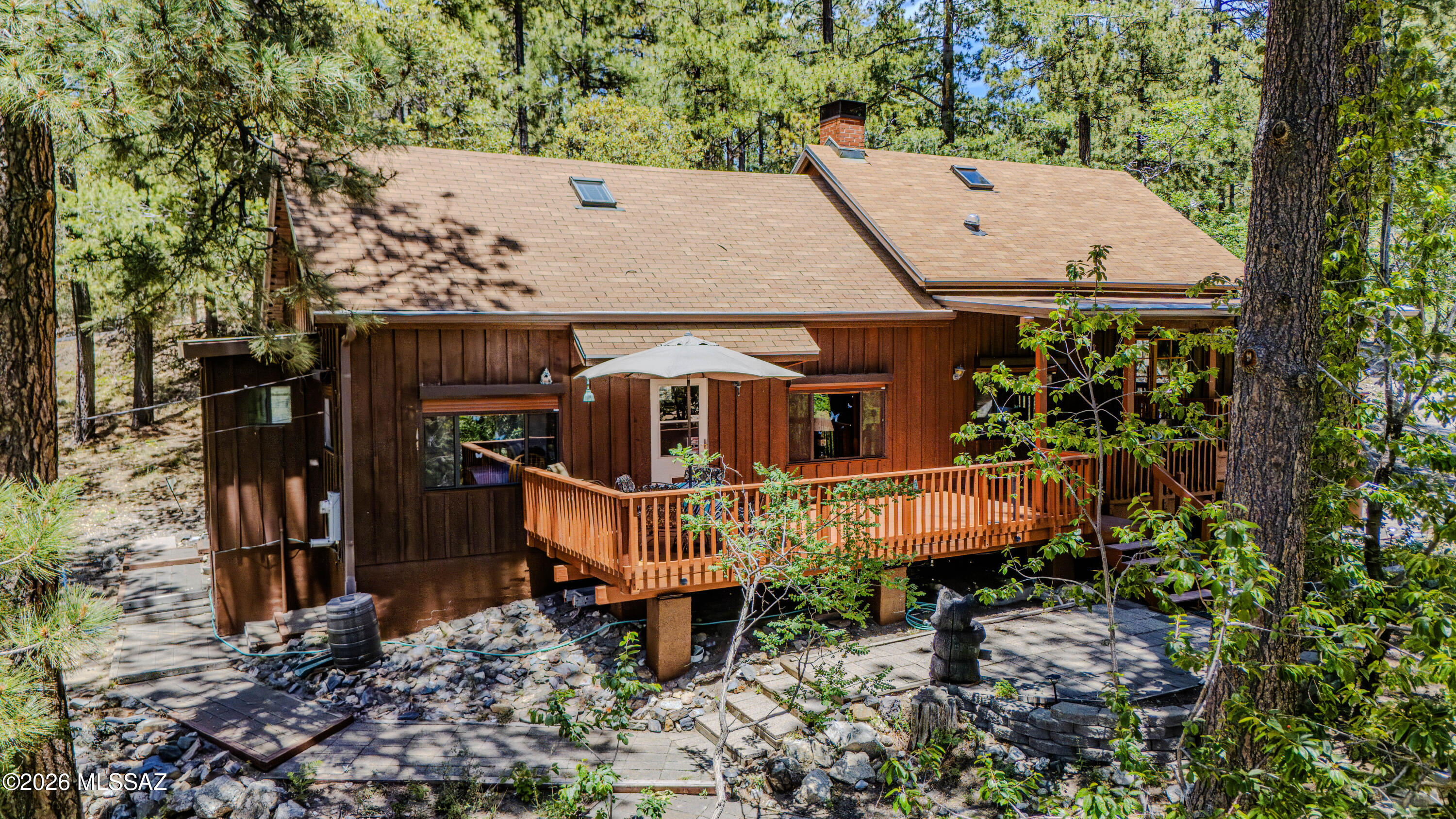Located in the coveted Loma Sabino area in Summerhaven. 1/3 acre lot on year around access road.  Large 1 bedroom,  1 loft bedroom and loft off primary bedroom. 2 full bathrooms. Kitchen boasts Thomasville cabinetry, & Corian
farmhouse sink  and countertops.  Laundry room with washer and dryer.  Large deck designed for entertaining with amazing mountain views.  8X12 workshop.  Rolling shutters for security when you are away. Too much to mention.  Cabin is being sold fully furnished. Come feel the daily stress melt away in this amazing mountain retreat.