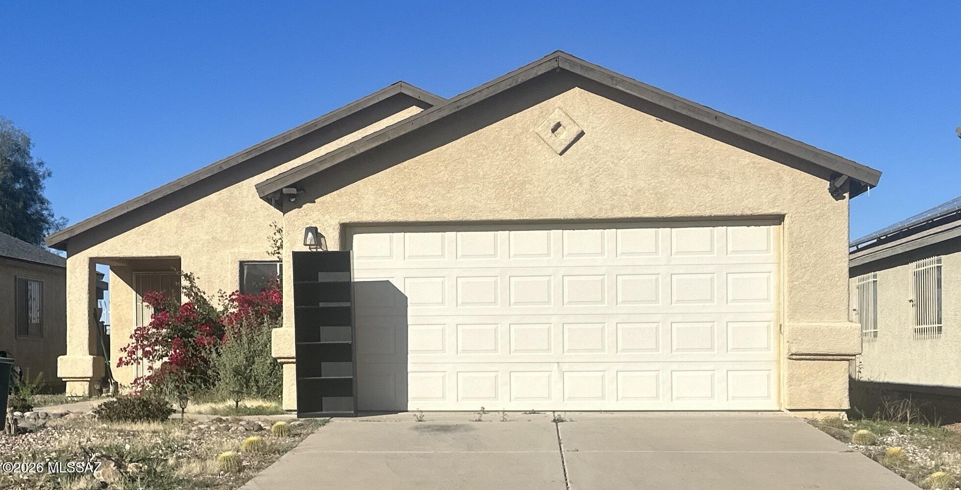 Single story with three bedrooms and two bathrooms.