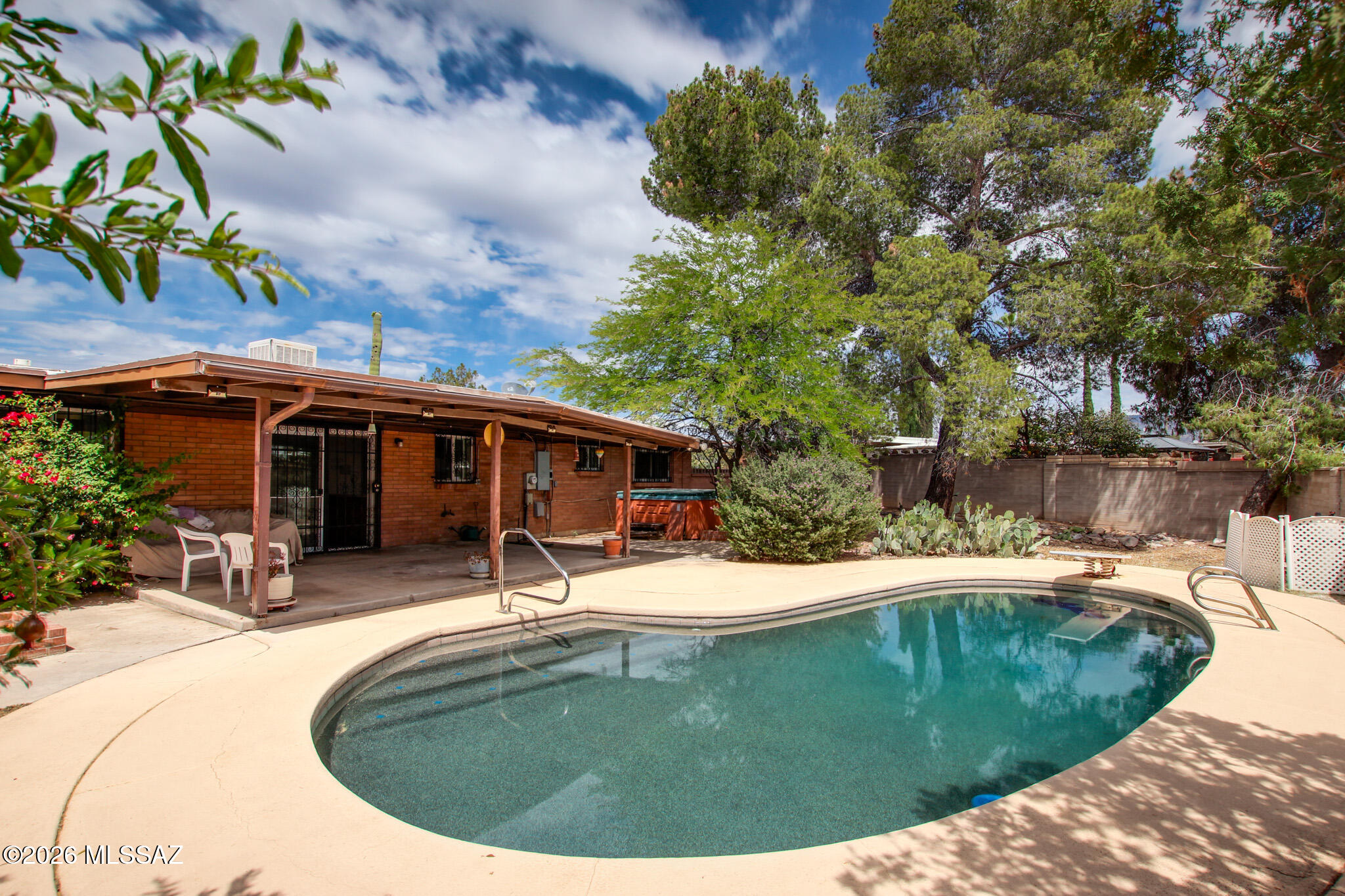 Charming East Side ranch home with endless potential! Featuring a sparkling Pebble Tec pool, this property is perfect for relaxing or entertaining. Priced below market value, it's a fantastic opportunity for buyers looking to add their personal touch and build instant equity. Spacious layout, desirable location, and great bones make this home a rare find. Don't miss your chance to customize and create your dream space!