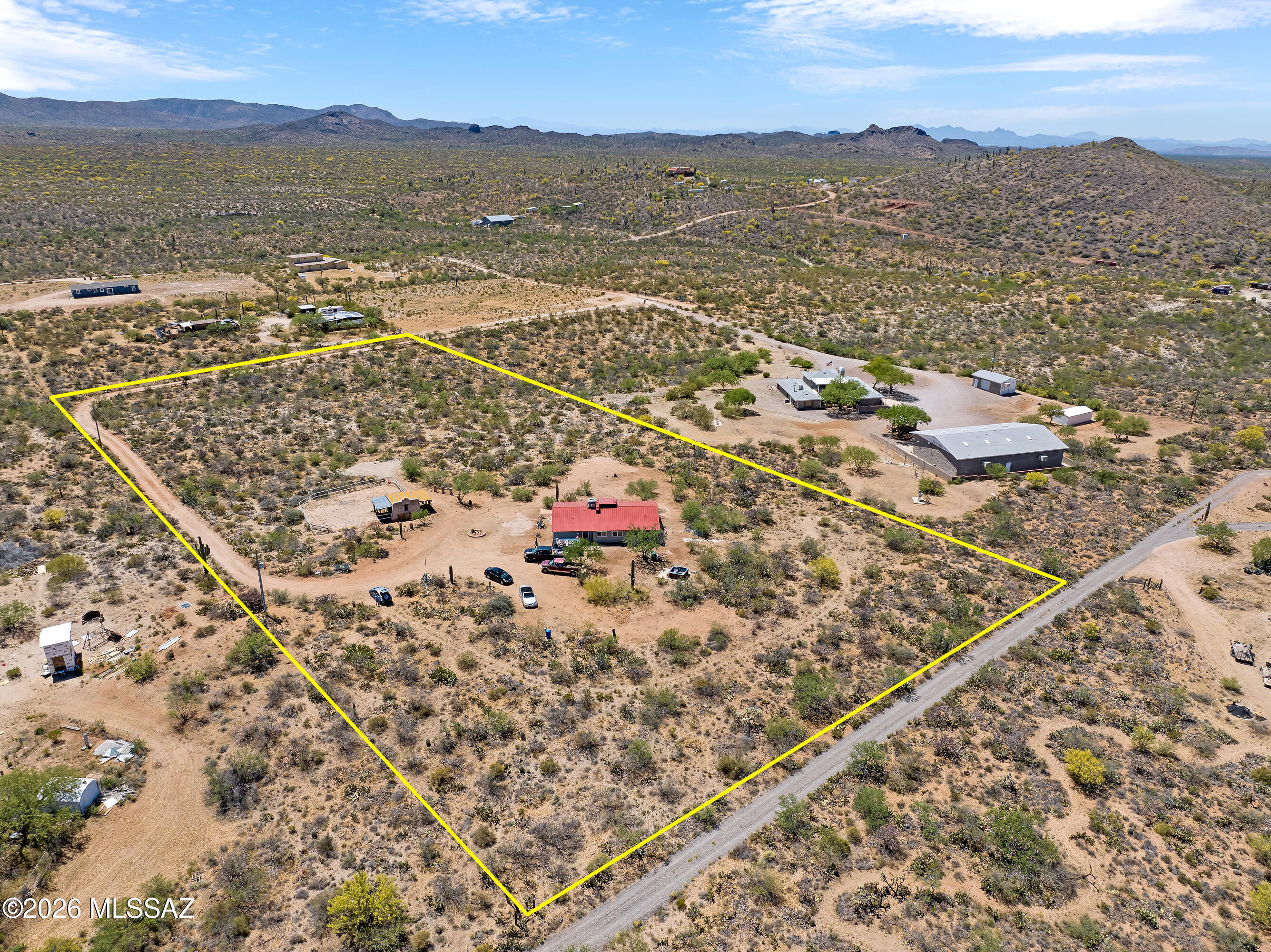 Saddle up for a fresh start at this fully reimagined desert homestead where rugged ranch life meets brand-new everything. Set on wide-open acreage with jaw-dropping mountain views, this property has been completely remodeled from top to bottom. It features a new metal roof, fresh stucco, updated flooring, modern appliances, your own private well & more, giving you the feel of a new home with the soul of the Southwest. Step inside to a clean, comfortable interior designed for easy living after long days under the Arizona sky. Every detail has been thoughtfully upgraded, creating a move-in-ready space that's equal parts practical & inviting. Outdoors is where this property really shines. A round corral/pen and tack room are ready for your horses or hobby livestock, making it perfect for those craving that authentic ranch lifestyle. With plenty of room to roam, ride & breathe, you'll find freedom in every direction.
Whether you're chasing sunsets, raising animals, or just looking to unplug & unwind, this property delivers that true Western spirit, wide open, hard to beat & ready for your next chapter! Investment property, 3 contiguous approved lots with Ranch House and Tack Room and Corral on 2 1/2 acres. Shared well for all 3 lots and electricity is on pole at property line. The two additional parcels are 1.25 acres. All defined and approved building lots by Pinal County. Could become a family compound.