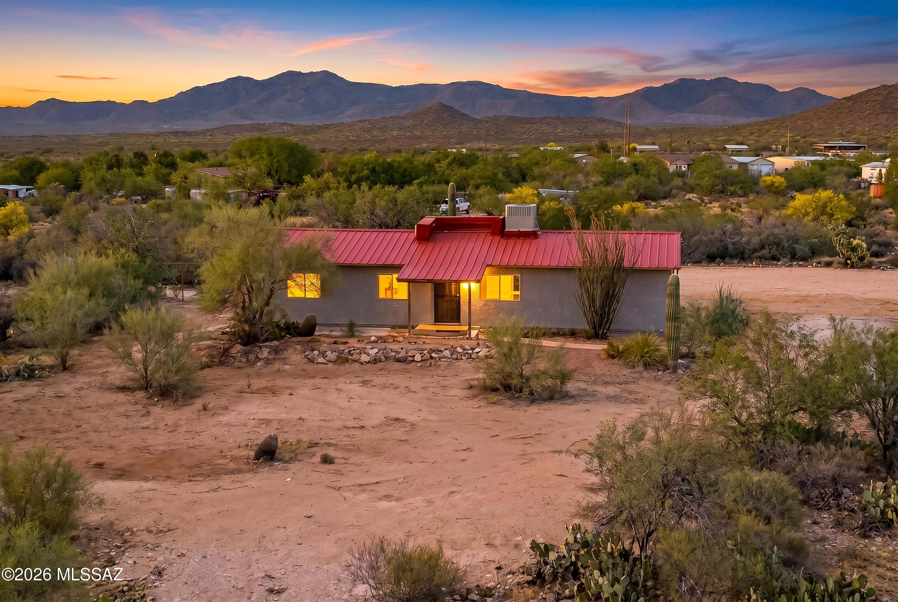 Saddle up for a fresh start at this fully reimagined desert homestead where rugged ranch life meets brand-new everything. Set on wide-open acreage with jaw-dropping mountain views, this property has been completely remodeled from top to bottom. It features a new metal roof, fresh stucco, updated flooring, modern appliances, your own private well & more, giving you the feel of a new home with the soul of the Southwest. Step inside to a clean, comfortable interior designed for easy living after long days under the Arizona sky. Every detail has been thoughtfully upgraded, creating a move-in-ready space that's equal parts practical & inviting. Outdoors is where this property really shines. A round corral/pen and tack room are ready for your horses or hobby livestock, making it perfect for those craving that authentic ranch lifestyle. With plenty of room to roam, ride & breathe, you'll find freedom in every direction.
Whether you're chasing sunsets, raising animals, or just looking to unplug & unwind, this property delivers that true Western spirit, wide open, hard to beat & ready for your next chapter! Investment property, 3 contiguous approved lots with Ranch House and Tack Room and Corral on 2 1/2 acres. Shared well for all 3 lots and electricity is on pole at property line. The two additional parcels are 1.25 acres. All defined and approved building lots by Pinal County. Could become a family compound.