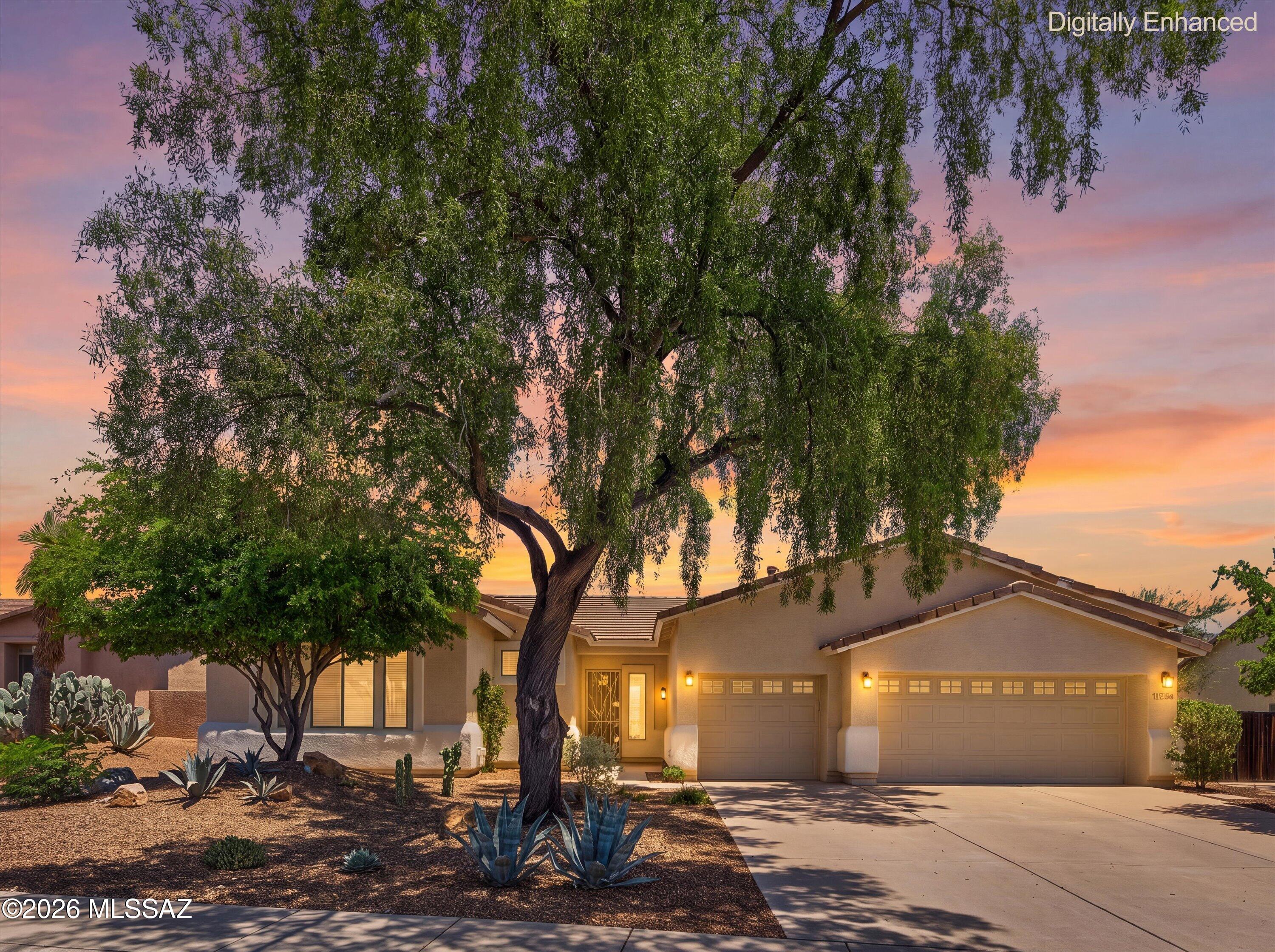 Wake up to panoramic, unobstructed views of the Catalina Mountains from this east-facing Desert Vista home, where a sparkling pool and gorgeous mountain backdrop set the stage for true Arizona living. This 4-bedroom, 3-bathroom split floor plan offers a formal living room, a separate family room, a formal dining room, and a cozy breakfast nook, giving everyone room to spread out. Walk through the foyer and you're immediately greeted by unobstructed views of the Catalinas framed through oversized picture windows -- a first impression that never gets old. A 3-car garage adds everyday convenience to this exceptional home.
The eat-in kitchen anchors the home with oak cabinetry, black appliances, a large center island, gas range, built-in work desk, and walk-in pantry, plus a bright breakfast nook for casual everyday dining -- designed for both everyday meals and effortless entertaining.
From the kitchen, the space flows into a bright family room, a formal dining room, and a separate formal living room, all filled with natural light from oversized picture windows. Neutral ceramic tile runs throughout the main living areas, offering an easy, low-maintenance flow from room to room.
The primary suite is a true retreat, with a private door opening to the covered patio, a spa-like primary bath featuring a garden tub and separate walk-in shower, and a generous walk-in closet. On the opposite wing, three additional split bedrooms share convenient nearby bathrooms, with brand new carpet throughout -- offering flexibility for a home office or guest space. A dedicated laundry room with sink and ample storage adds everyday functionality.
Step outside to the true showstopper: a massive covered patio with extensive kool decking wrapping around a custom Pebble Tec pool, all framed by unobstructed Catalina Mountain views and backing to open desert common area for added privacy. Zoned A/C and brand new AC units keep the home comfortable year-round.
Desert Vista is one of Oro Valley's most sought-after neighborhoods, offering a true sense of community alongside its natural desert setting. Walking and biking paths wind throughout, connecting residents to a neighborhood park and playground. The location is just minutes from top-rated schools, the library, and a wide range of shopping and dining options, offering both quiet desert living and everyday convenience.
Amongst the very best mountain views Oro Valley has to offer -- this is Desert Vista living at its finest.