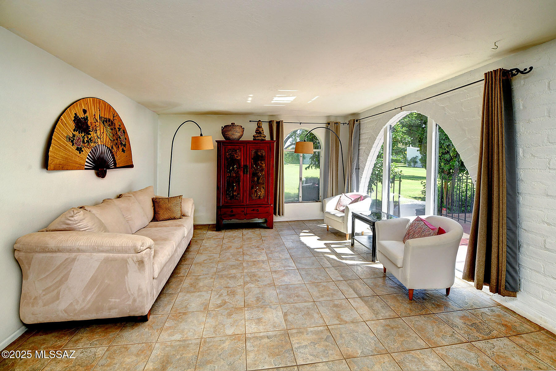 LOCATION, LOCATION, LOCATION! THIS CHARMING BURNT ADOBE 2 BR/ 2 BA CONDO IS IN A GORGEOUS SPOT PERFECTLY SITUATED IN THE MIDDLE OF THE CASITAS DE CASTILIAN W/ VIEWS OF MANY MATURE FRUIT TREES, GRASS & THE CATALINA MOUNTAINS! THIS VERY SPECIAL HISTORICALLY DESIGNATED OVER 55 COMMUNITY WAS DESIGNED BY RENOWNED ARCHITECT BENNIE GONZALES. HOME BOASTS LOTS OF LIGHT, CERAMIC TILE FLOORING THROUGHOUT (NO CARPET), FRONT & BACK BRICK PATIOS, LOTS OF ARCHED WINDOWS, GAS COOKTOP & STAINLESS-STEEL APPLIANCES PLUS A 3-YEAR-OLD HEATING/COOLING SYSTEM! HOA FEE COVERS TWO POOLS (LAP POOL IS HEATED), TENNIS COURT, CLUBHOUSE, MAINTENANCE OF BUILDINGS & GROUNDS, WATER, GARBAGE PICKUP & BLANKET INSURANCE POLICY. PROPERTY TAXES ARE EXTREMELY LOW DUE TO HISTORIC DESIGNATION!
