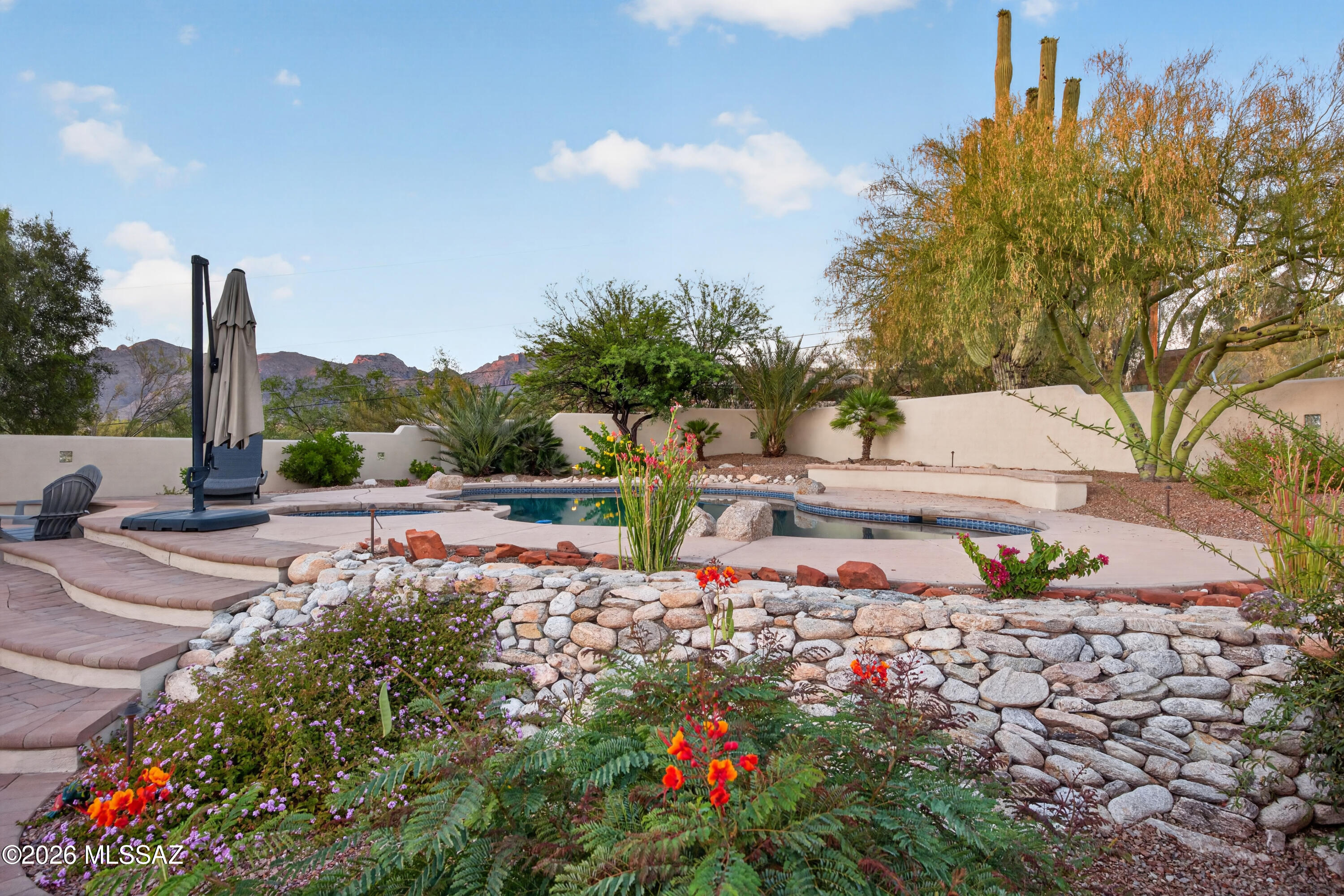 Oracle Foothills Estates • 4 beds • 2 baths • 2,400 sq ft • Pool • Mountain views • Bonus A/C office • Near golf, resorts, dining, hiking, U of A and pickleball

Located in Tucson's Oracle Foothills Estates area near the Catalina Foothills, 5585 N Maria Drive offers 4 bedrooms, 2 baths, and 2,400 square feet on a 1.57-acre lot. The updated kitchen features generous counter and cabinet space, a large dining area, and an included refrigerator. Flexible living areas include a fireplace, plus a separate bonus A/C office off the garage for work, hobbies, or storage. The backyard features a sparkling pool, mature vegetation, and mountain views. Enjoy close access to golf, Tucson's premium resorts, shopping, restaurants, hiking, the University of Arizona, and pickleball options.