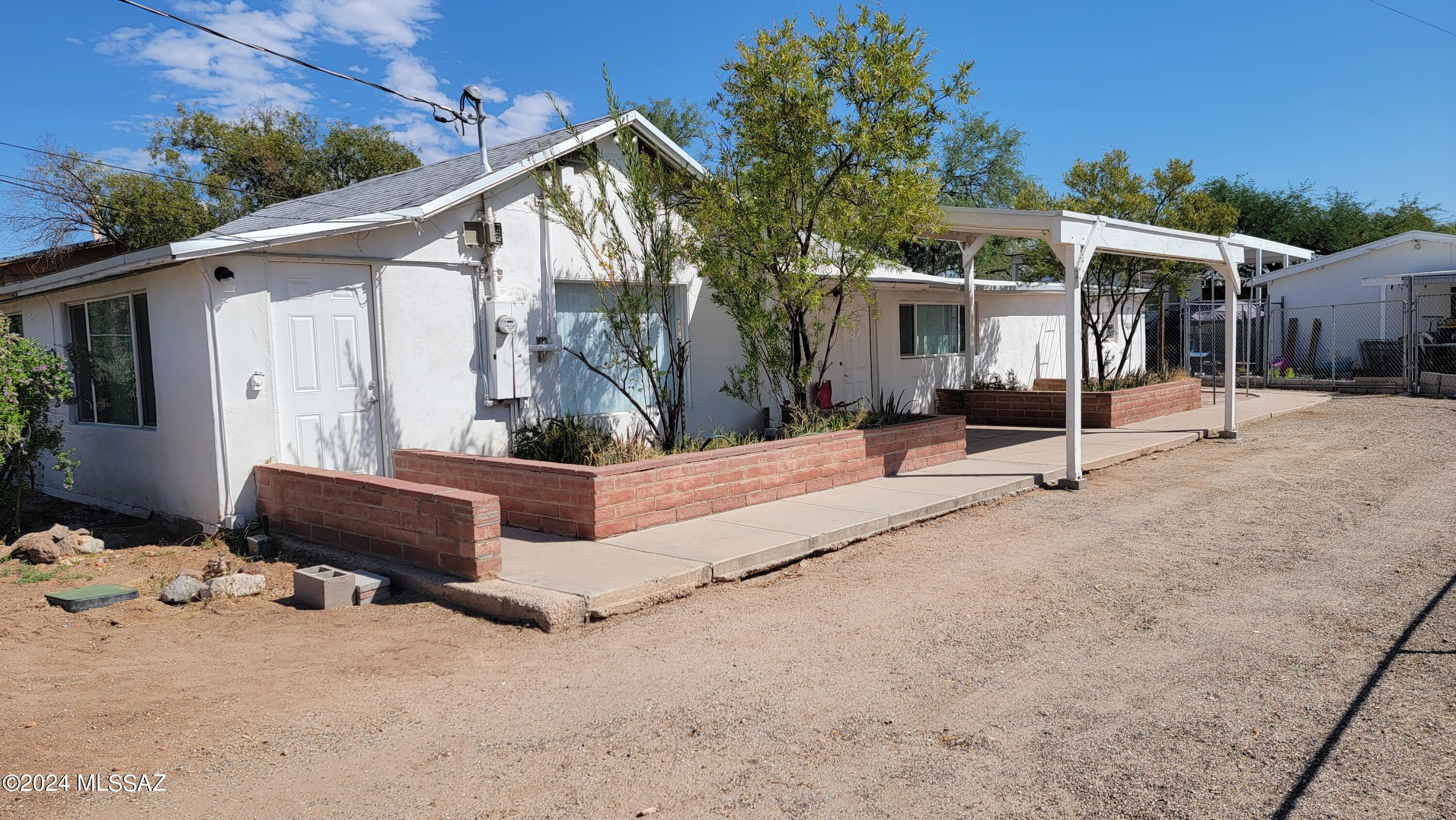 2726 N Estrella. Three bedroom, two bath with all tile flooring, ceiling fans and AC.  Fleshly painted interior and new dishwasher This home has a large yard and washer and dryer.  Close to shopping, restaurants, Pima downtown campus and  U of A. Call today.