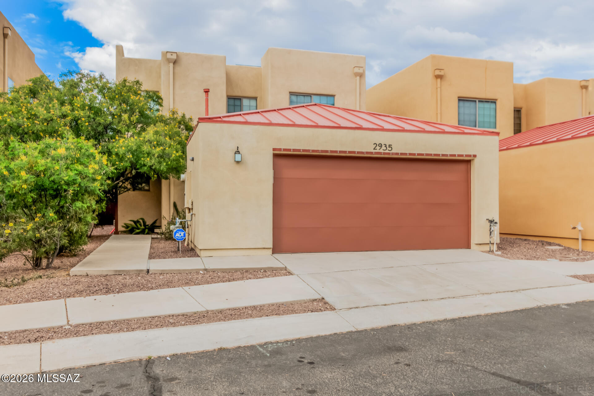 Rare Find! Beautiful 3 BR / 2.5 BA Home in quiet gated north central community has so much to offer. 2 Story, N/S Exposure, New Interior Paint & Carpet, Beautiful Kitchen SS Appliances, Gas Stove, Washer/Dryer, Primary Downstairs w/ 2 Walk In Closets, Updated Bathroom, Great Room High ceilings open to second story allowing for lots of natural light & open airy feel, 2 Loft Nook Areas upstairs perfect for Home Office, Play Area, Private Backyard,Etc. 2024 New Garage Door w/ Smart System. Over $40,000 in Updates! 2010 Home in small community of 18 homes w/ nature park, set back from major roads, offers secluded private living, yet walking distance to Racquet Club, Winterhaven, Rio Vista Natural Park, Rillito River Paths, The Loop & More.  CONT... Close to University of Arizona, St Phillips Plaza, Banner Hospital, Shopping, The Loop (walking & riding paths) & More. This is a RARE FIND. Welcome HOME!