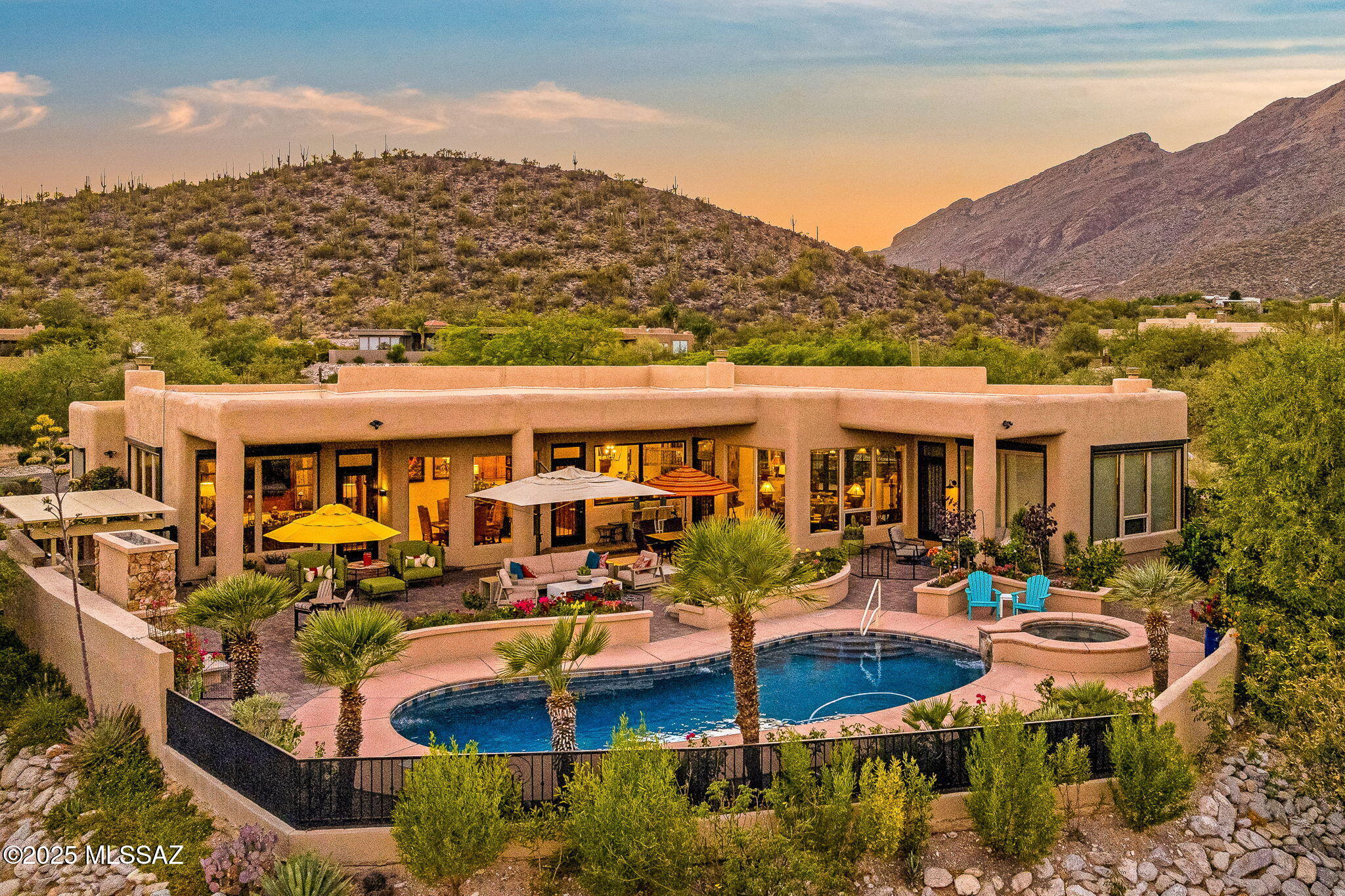 Welcome to The Crown Jewels Estate, where panoramic views sweep across the Catalina Foothills and the glittering city lights sparkle below like a necklace of diamonds. This five bedroom, four bath estate is more than a home. It is a masterfully reimagined sanctuary that balances elegance, modern convenience, and timeless Tucson charm.

Step inside to find every thoughtful upgrade already in place. From the brand new resealed roof to custom iron security doors, solar shades with remote control, and a tankless Rinnai water system with a circulating pump, no detail has been overlooked. The kitchen is a true showpiece, completely redesigned with a relocated cooktop for functionality, a Viking range and microwave, dual Bosch dishwashers, beverage refrigerator, and striking quartz counters. Every appliance, fixture, and cabinet has been carefully chosen, soft close, and perfectly styled.
Every room has been touched with luxury including travertine floors, new high-end carpet in bedrooms, California Closet systems, Hunter Douglas window coverings with remote controls, and custom shower and window installations. Even the garage received the royal treatment with epoxy floors, split air, and California Closet storage.
The backyard is nothing short of a resort. Completely remodeled, it features a Hydrawise app-controlled irrigation system, custom paver patios, a Hestan outdoor kitchen, massive gas fireplace, weatherproof television, and top of the line outdoor speakers. This space was built for entertaining whether you are hosting a lively evening under the stars or enjoying a quiet sunset with the mountains as your backdrop.
Located in the heart of the foothills, this estate offers proximity to shopping, dining, golf, and the best of Tucson living while perched high above it with views so spectacular they inspired its name. When the sun sets and the city lights shimmer, you will understand why this home is truly The Crown Jewels Estate.