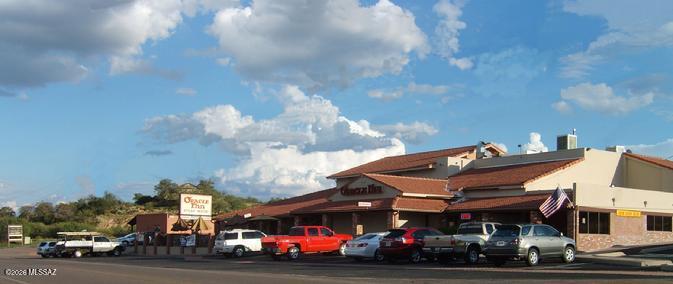 The Oracle Inn Steak House & Lounge is a very historic property that was added onto in 1974 which is the only recorded date for construction at the assessors office.  The property was totally remodeled in 2008.  The property fronts on the main street of American ave. with corner to corner frontage with lots of parking around the building.  Included with this sale is an adjacent parcel just South of the main parking lot used for extra parking.  The building has a great commercial kitchen for both the restaurant and bar side.  There is a breezeway that allows restaurant patrons to go directly into the Lounge after dinner.  There is a large outside patio on the North side of the building that faces American ave. with it's own bar and seating area.  There are also 2 banquet rooms.  A MUST SEE