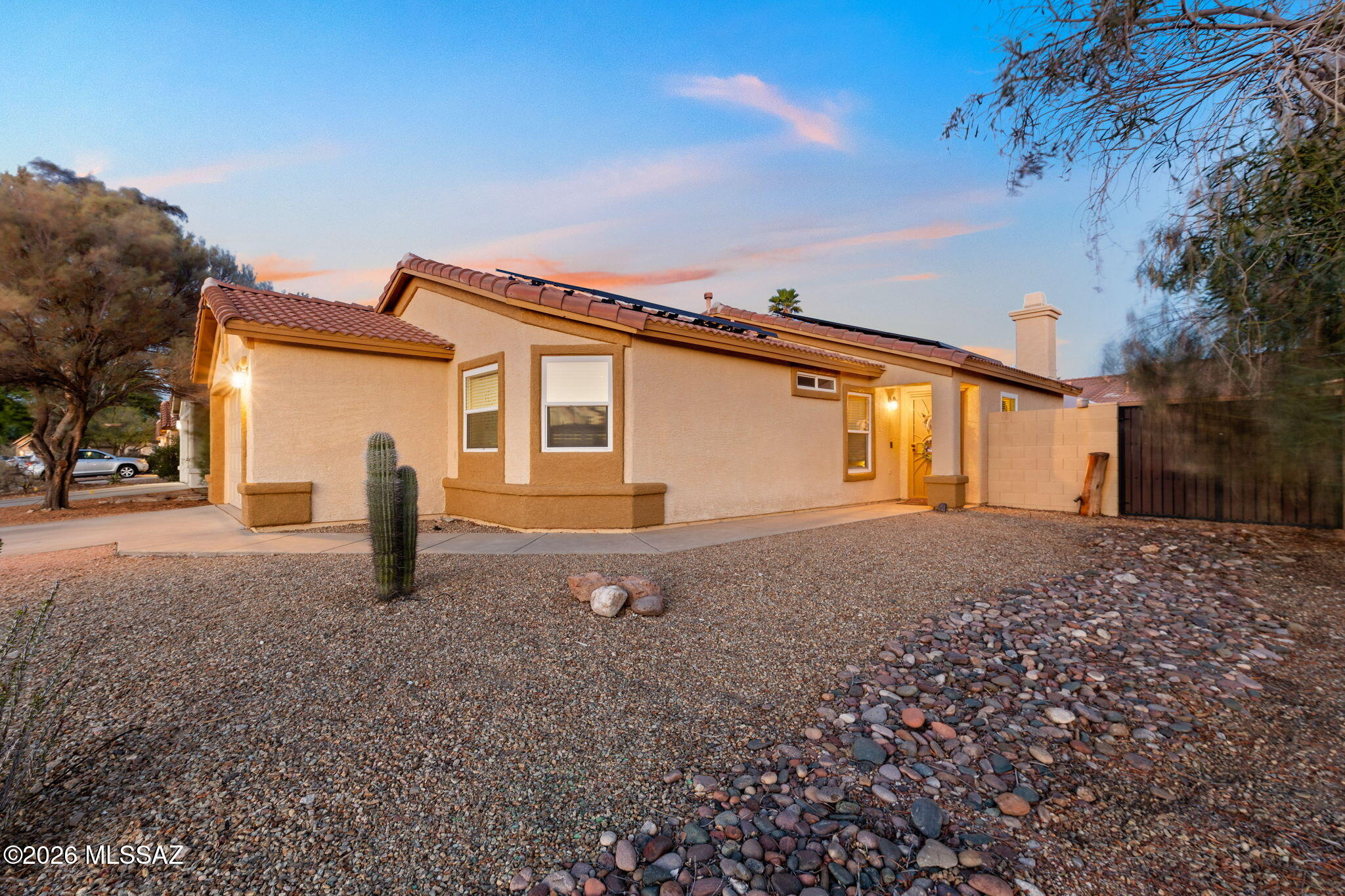 Corner lot in Continental Ranch! This 4-bed, 2-bath home is a walk from desert surroundings, neighborhood mountain views, and sunsets. Inside, 9+ ft ceilings run through main living areas, anchored by a cozy fireplace. Split floor plan places primary suite near living space with walk-in closet, dual vanities, soaking tub, separate shower, and private toilet room. Kitchen offers stainless steel appliances, new dishwasher, wood tone cabinetry, with hallway access to three secondary bedrooms, full bath, and laundry. Tile throughout. Backyard features gravel landscaping, gazebo, 6ft wall, HOA approved 11x12 shed on slab, and gas ready patio. 2 car garage includes 220V power, 2025 opener, 2025 owned softener, RO system, leased solar, and fiber internet. Access shopping, dining and bike trails.