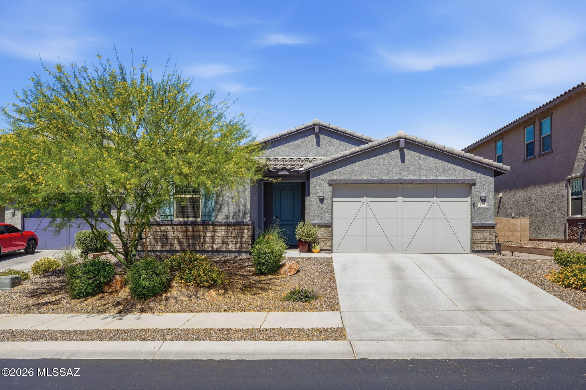 Fantastic opportunity to own a ''better than new'' home w/all of the bells & whistles! Fabulous location in a premier gated community, professionally landscaped yards, custom pool, plus pergola for bonus entertaining space. Premium lot offers privacy, backing to open desert common area. Wood-look tile plank flooring in all living spaces, high ceilings, split floor plan, open concept w/modern chef's kitchen & generous breakfast bar island. California Closets custom built-in office work space & complete primary closet make-over. Storage galore! Epoxy garage floor & bonus work shop area. Built in 2023 w/the latest ''smart home'' technology & is under the builder's structural warranty. This well maintained gated community has a park, sidewalks & a friendly neighborhood vibe.  This is a keeper!