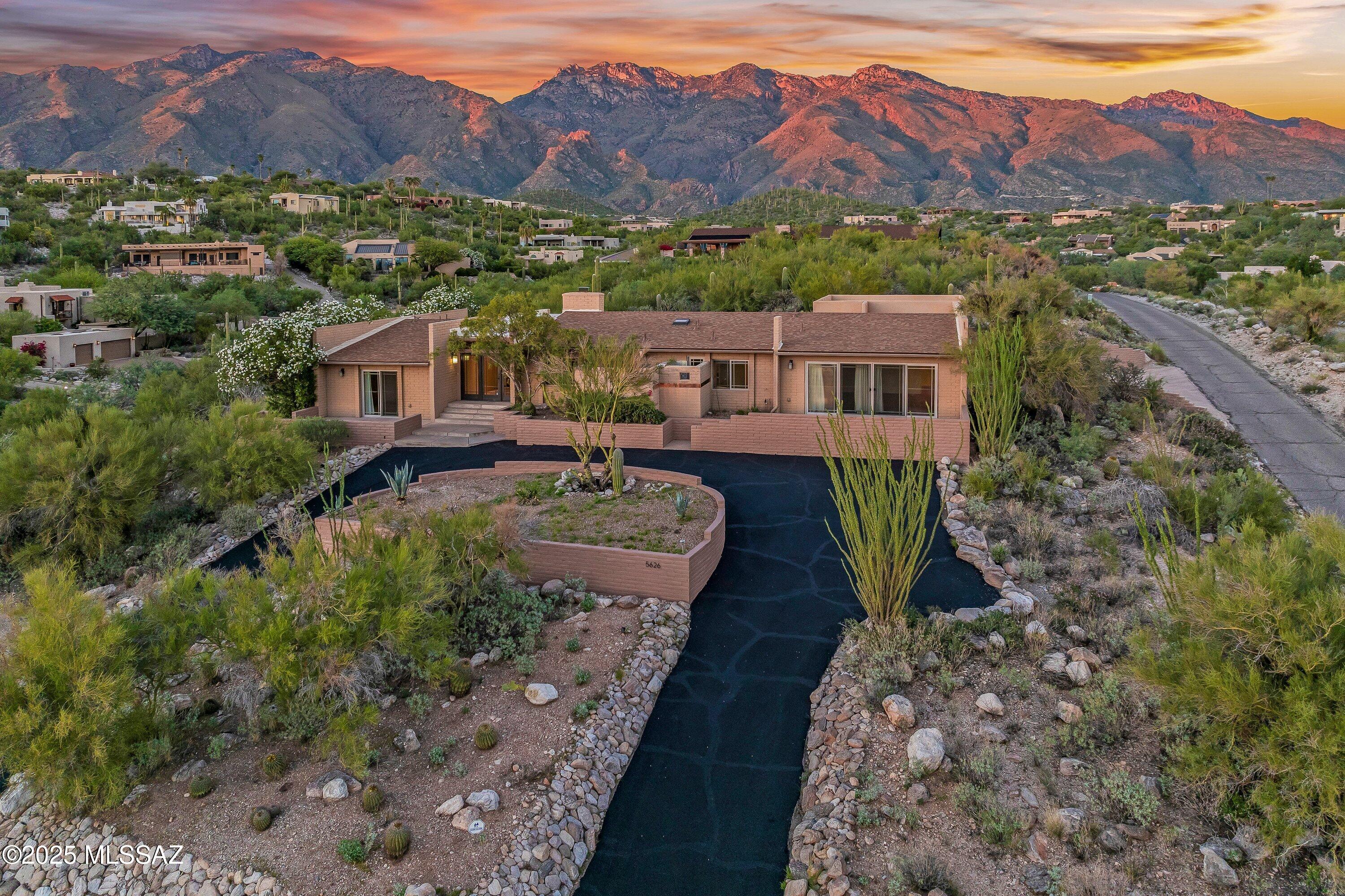 Experience the best of Tucson from this 4-bedroom, 3-bath hilltop home in Cimarron Foothills Estates, where every day feels like a retreat. From sunrise over the Catalina Mountains to the sparkling city lights at night, the panoramic views are simply breathtaking.
Step inside to bright, open living spaces that effortlessly connect to the outdoors. Expansive windows invite sunlight and desert scenery into nearly every room, creating a serene, uplifting atmosphere throughout the home.