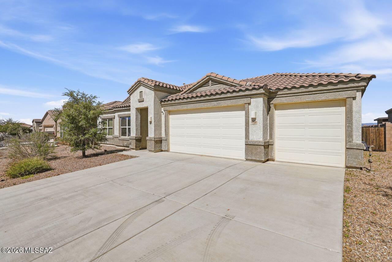 Welcome to modern desert living in the peaceful community of Corona de Tucson. This 2021 built, home blends contemporary comfort with the tranquility  of rural inspired living--offering space, privacy, and serenity. The open concept floor plan features 4 spacious bedrooms, 3 bathrooms, and a den. High ceilings, abundant natural light, and modern finishes elevate every room for a clean, refreshed feel. The kitchen offers a generous island, pantry, and seamless flow into the living/dining areas. Enjoy the low maintenance yard with room to entertain, garden, or unwind beneath the stars. This  home delivers the benefits of living away from the  hustle of the city while being minutes from top rated Vail schools, dining, & outdoor recreation. You will love the spacious 3 car garage with EV charg