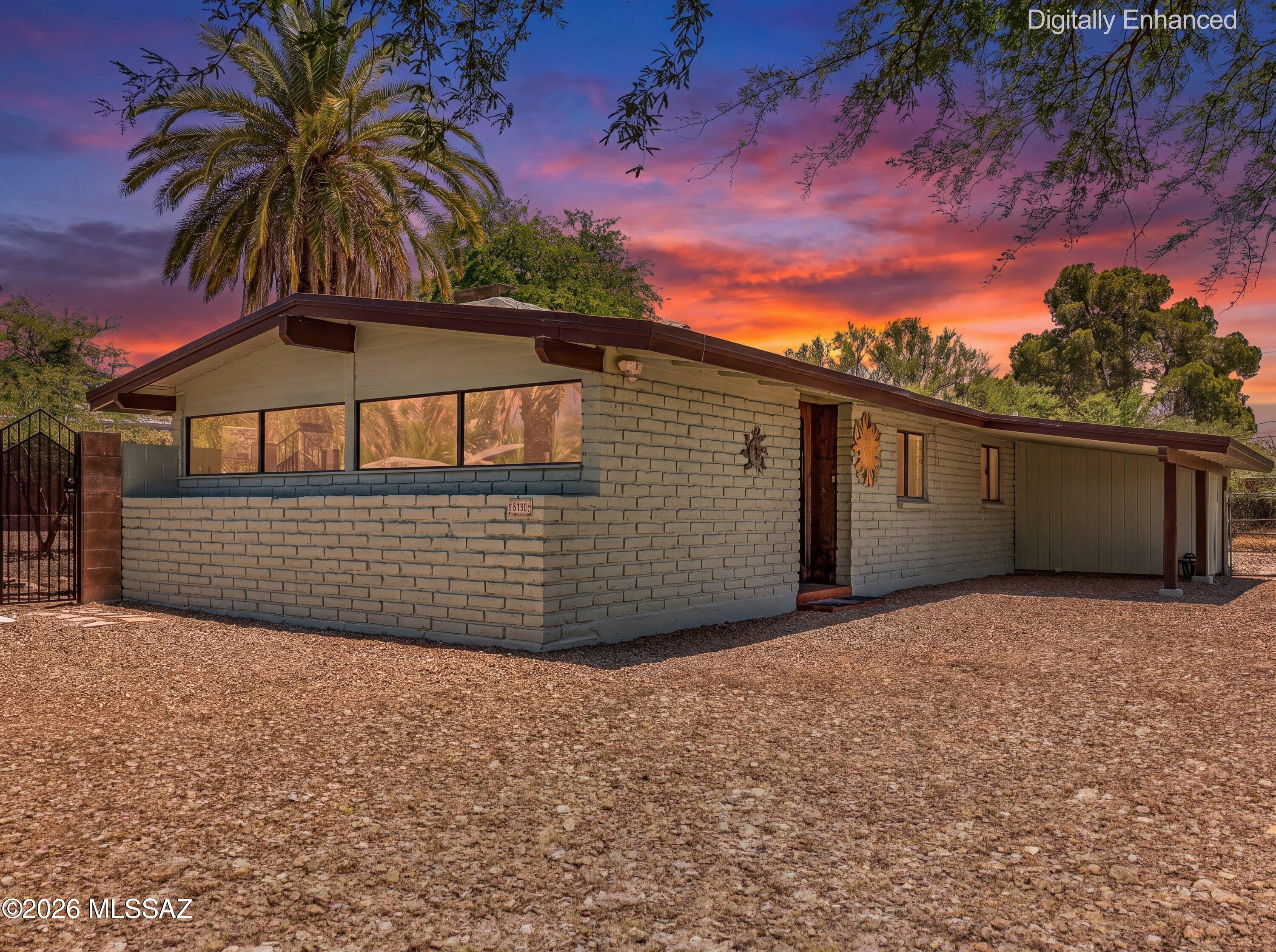 Nestled on a quiet cul-de-sac in Tucson's historic Indian Ridge Estates, this 3-bedroom, 2-bath home offers 1,635 square feet of classic Mid-Century Modern charm. Built in 1956, the residence showcases authentic character with Saltillo tile flooring, a striking three-way fireplace that serves as the heart of the home, and spacious living areas designed for comfortable everyday living and entertaining. Step outside to your private backyard retreat featuring a refreshing pool, mature landscaping, and ample space to enjoy Tucson's year-round sunshine. A rare opportunity to own in one of Tucson's most sought-after historic neighborhoods, close to shopping, dining, recreation, and Tucson's Eastside amenities.