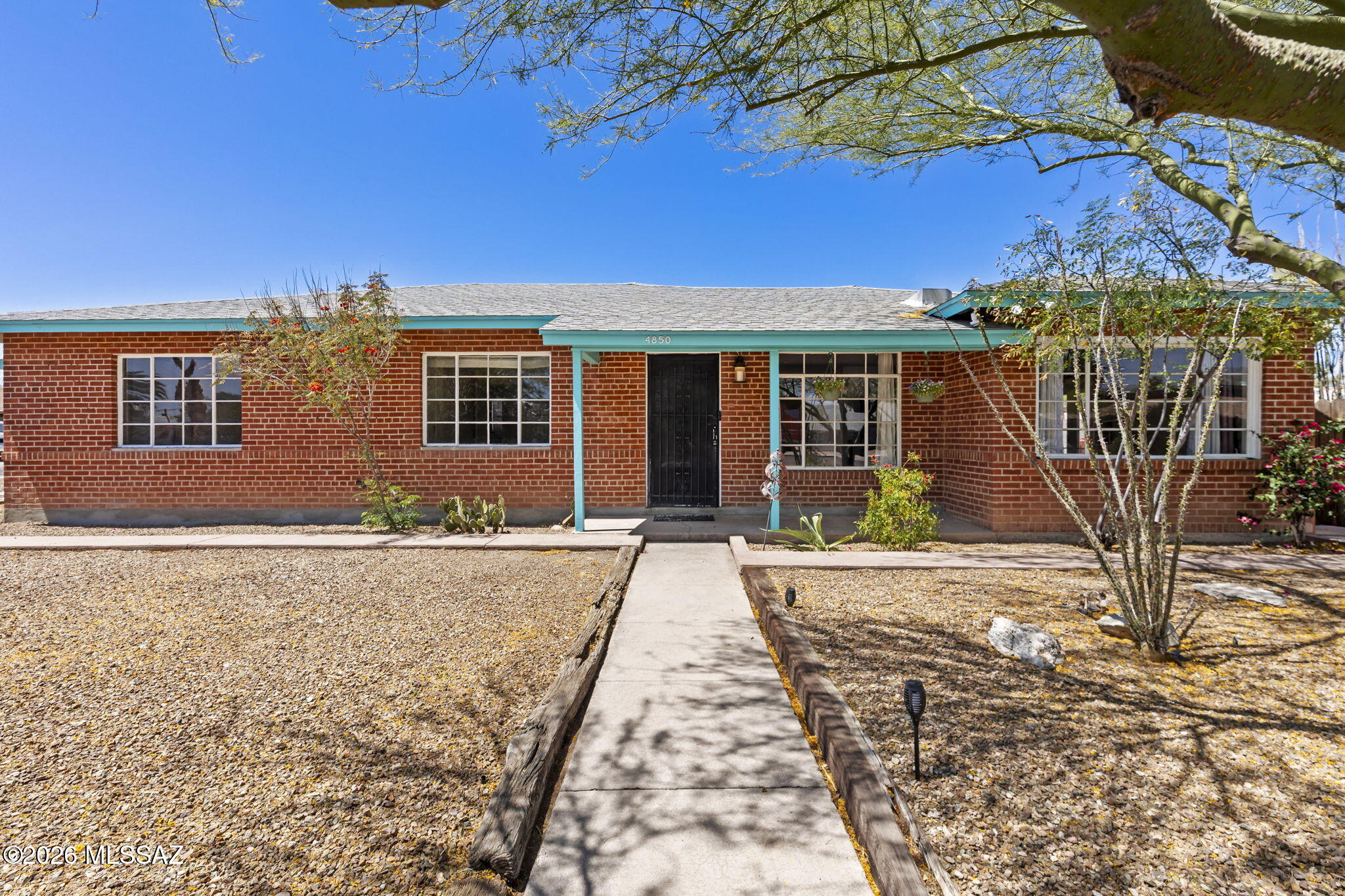 Hoffman 1/3 Acre Corner Lot Mid-Century Brick Home. neighborhood is a short walk to Bonillas Elementary. 1786sf per assessor, 1539sf main living area, 209sf climate controlled utility rm w/3rd bath, plus 10x8 storage rm. True great room plan w/large dining ell. Kitchen w/granite counters, SS appl. Charming Retro baths. Wood laminate & tile flooring throughout! 2021 CENTRAL AC! French doors & casement windows let in tons of light. Huge walled yard perfect for parties! Cov Patio & Flagstone BBQ Ramada. Storage & bonus space! Close to restaurants and shopping.