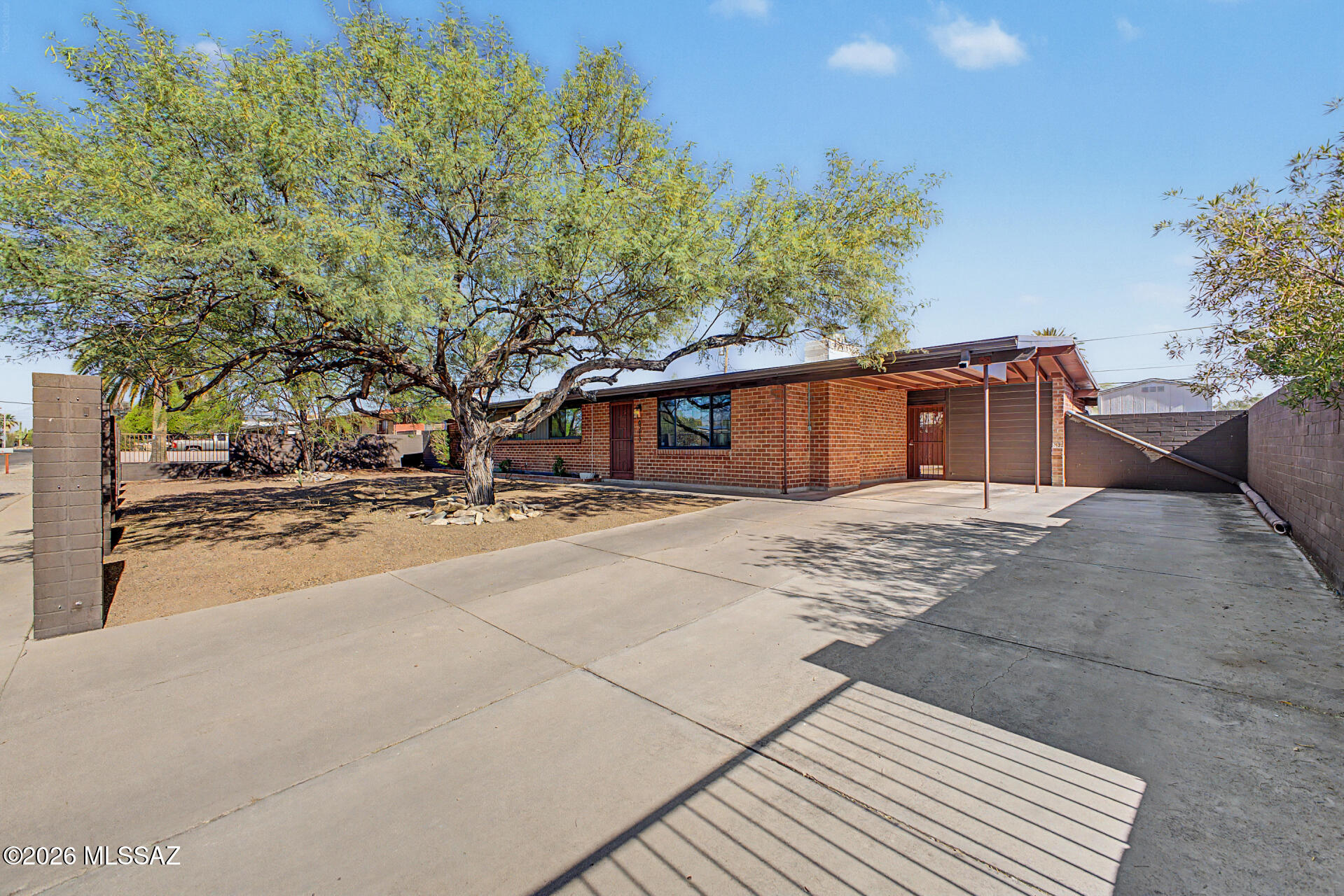 Beautifully remodeled and move-in ready, this 3-bedroom, 2-bath home in the heart of Tucson offers the perfect blend of modern style, comfort, and functionality. At the center of the home is the stunning open-concept kitchen, fully remodeled in 2023 with all-new appliances, updated cabinetry, modern finishes, and an ideal layout for both entertaining and everyday living. The spacious primary bathroom was completely renovated in 2024, creating a fresh, spa-inspired retreat. Additional upgrades include new Pergo flooring throughout, all new interior doors and baseboards, and premium Pella windows that enhance both energy efficiency and natural light throughout the home.The floor plan and extensive updates make this home truly turnkey and move-in ready.