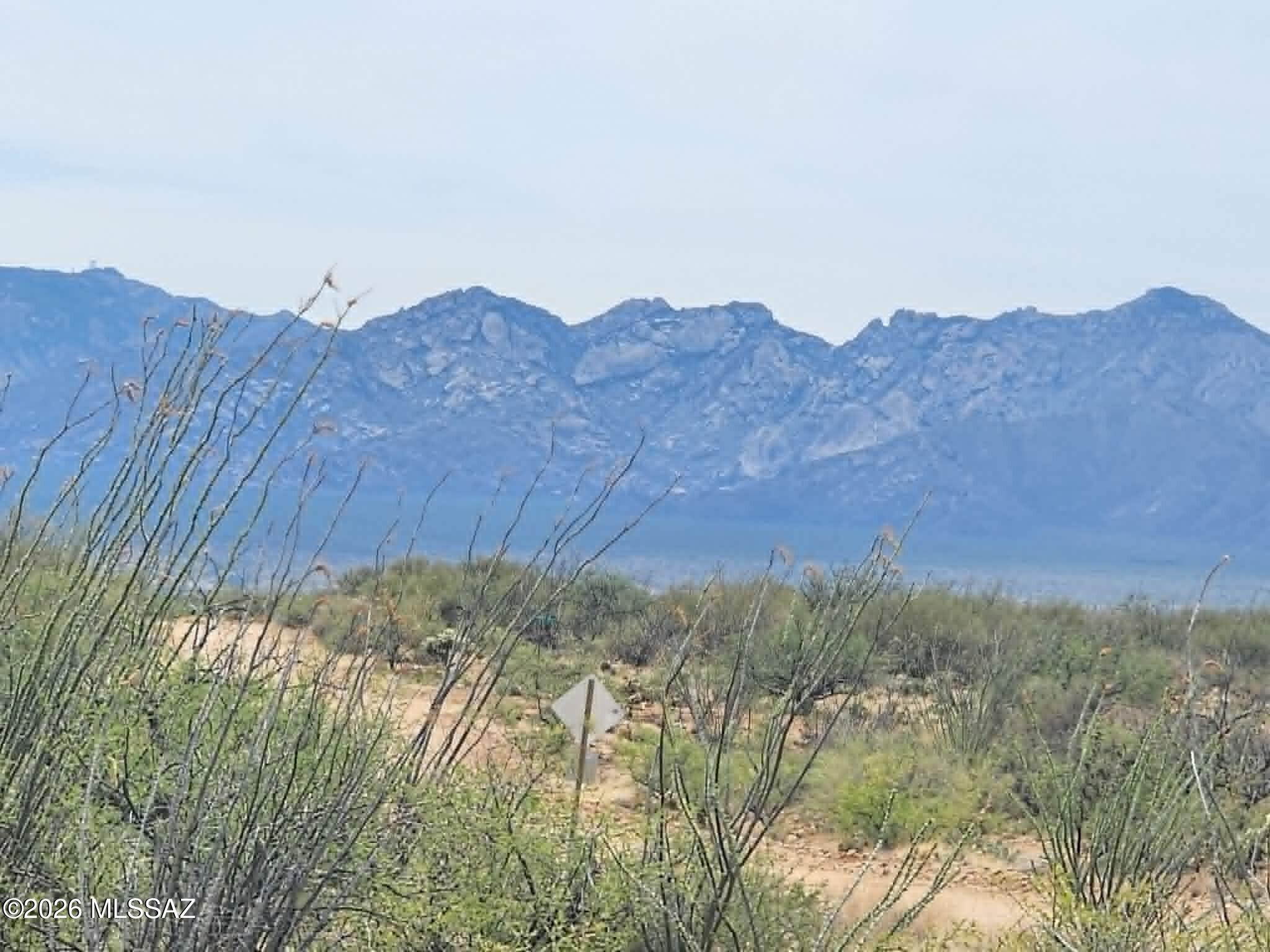 Hurry this 1+ acre lot in the desirable Diamond Bell Ranch community won't last long with these gorgeous 360° mountain views, and unforgettable Arizona sunsets. With no HOA, enjoy the freedom to live your lifestyle, horses are welcome, and you'll have miles of dirt roads ideal riding and exploring. This peaceful desert property offers plenty of room for your toys, future home plans, or a solid investment opportunity. Zoned CR-1 for site-built homes only, you can live off-grid with solar and hauled water or drill a well, with utilities expected in the future but not currently available. At approx. 3,500ft elevation, the property enjoys slightly cooler temperatures and increased rainfall, all just 30 minutes from Tucson.