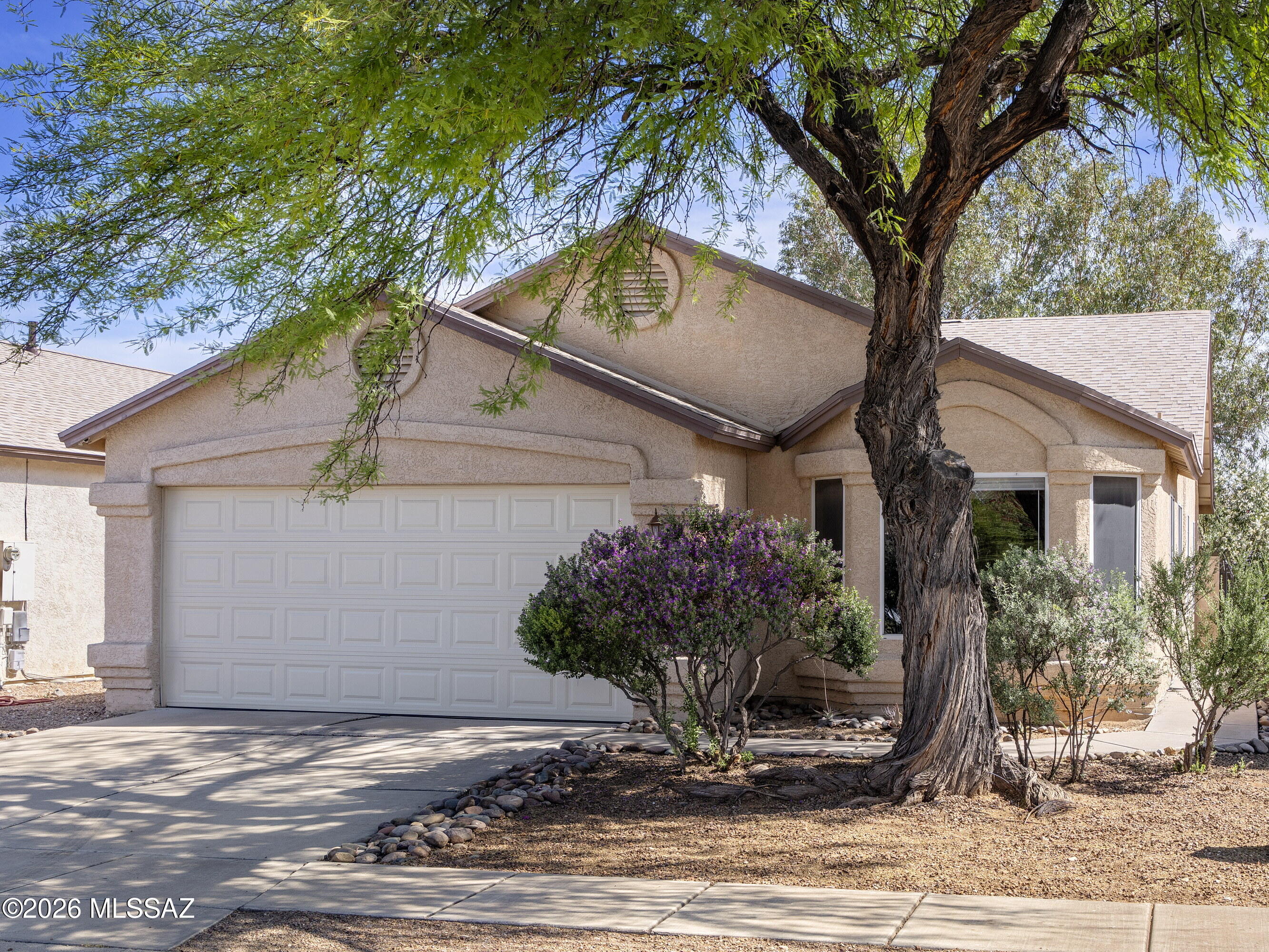 HOME BACK ON THE MARKET - Due to buyers being denied a loan the day prior to closing. Sellers shall entertain offers between $300,000 - $325,000.  Charming 3-bedroom, 2-bath ''doll-house'' located in the highly sought-after Vail School District! This beautifully maintained home offers a warm & inviting feel with high ceilings creating an open airy atmosphere. Laminate wood flooring & plush carpet, complemented by upgraded baseboards. Updated kitchen features granite countertops, ample cabinetry, a convenient pantry & cozy eat in nook perfect for casual dining. Spacious owners suite is a true retreat, complete w/an impressive walk in closet that offers exceptional storage. No poly pipes! Fully enclosed backyard w/block wall mature vegetation & shade, & an extended patio.