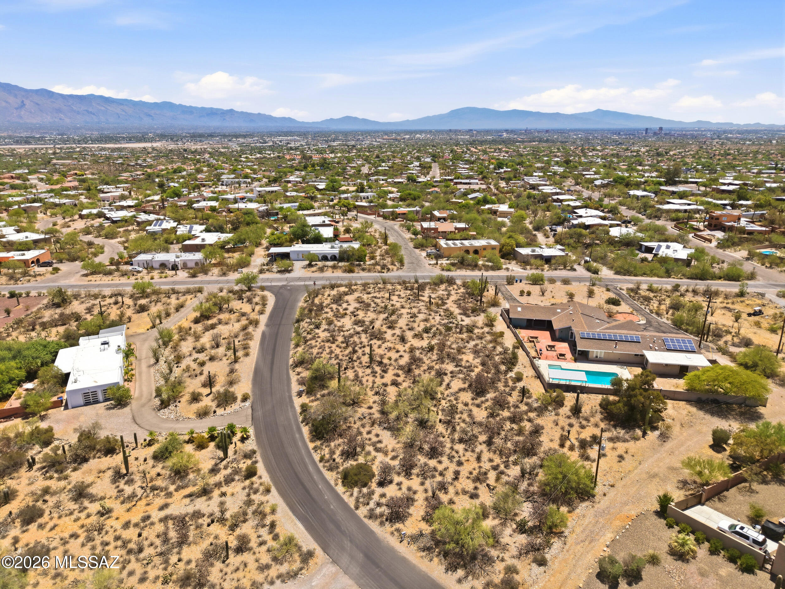 Don't miss this rare opportunity to own a premium lot in the Tucson Mountains!  This elevated corner homesite nestled within the highly desirable Painted Hills Estates offers breathtaking 270-degree views. Enjoy the perfect blend of privacy, scenery, & convenience, with easy access to downtown Tucson, I-10, Tucson Mall, St. Mary's Hospital, and outdoor destinations including Gates Pass, Saguaro National Park, and the El Rio Neighborhood Center. House plans are included with the sale, making it even easier to bring your dream home to life.