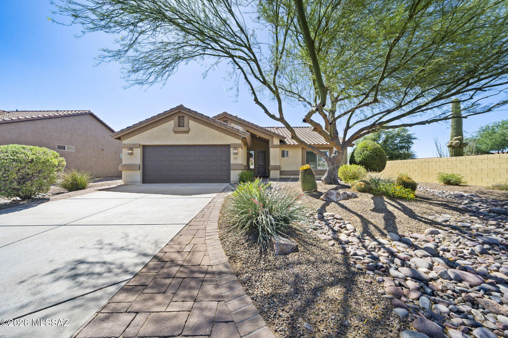Impeccably Maintained home features 2 bedroom/ 2 bath PLUS Den located in the highly sought after Quail Creek subdivision. This open floor plan is beautifully appointed to include granite CT, custom cherry cabinets, brand new SS appliances, nice big island for conversing with the cook, tile & LVP throughout, plantation shutters and much more!! The garage sports an epoxy coating and plenty of storage for the garage enthusiast as an added bonus. Retire to the backyard and enjoy the mature landscaping and the extended patio with plenty of shade where you can enjoy the beautiful AZ evenings. Community amenities are nearly endless, including a fantastic golf course, 16 pickleball courts, activity centers, pools, restaurant & more!! NOTE: NEW HVAC Aug. 2025, Appliances to include Refrigerator, Range, Dishwasher, Microwave, Washer/Dryer & garbage disposal November 2025, Water Heater 2021, New Ceiling Fans, Dining & Entry Lighting replaced November 2025 and interior paint throughout.