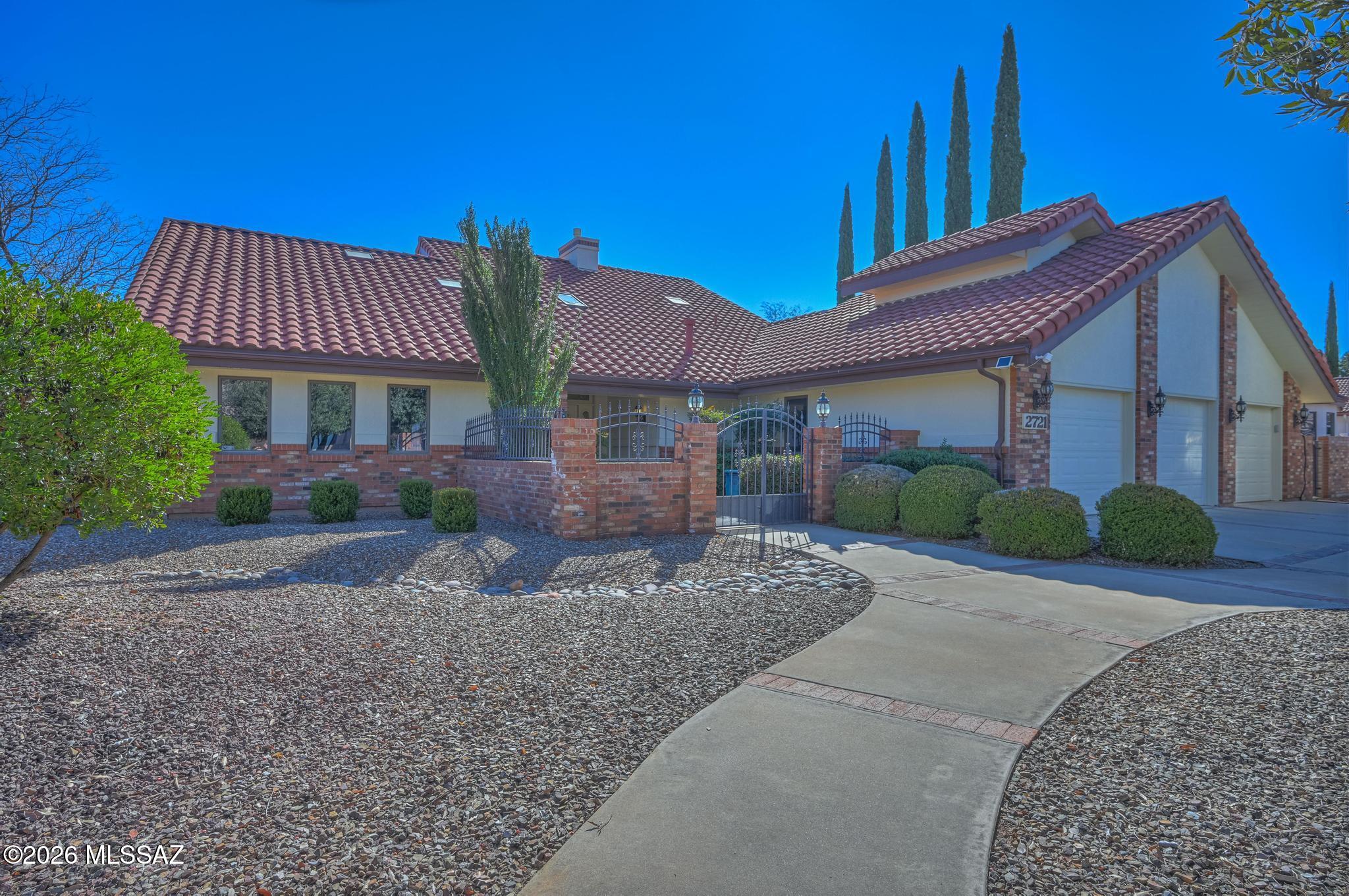 Originally built as the personal custom home of Cunningham Homes, this spacious 3BD/3BA luxury residence blends grand scale with a warm, inviting feel. Plantation shutters, wood & tile floor downstairs, a cozy gas fireplace, formal dining, and a gorgeous kitchen featuring an island wine rack, granite counters atop fine cabinetry, built-ins, and stainless appliances. Generous rooms include 2 private suites (one up/one down), a 3rd bedroom, huge loft, indoor laundry, and 3-car heated/cooled garage. Outdoor living shines w/a wraparound paver patio, gazebo, spa, outdoor kitchen, firepit, and ideal golf course positioning on #7 tee box. Large driveway w/RV parking & 50-amp hookup, gated courtyard entry, mature irrigated landscape, and numerous upgrades. Close to golf, activities & Ft. Huachuca