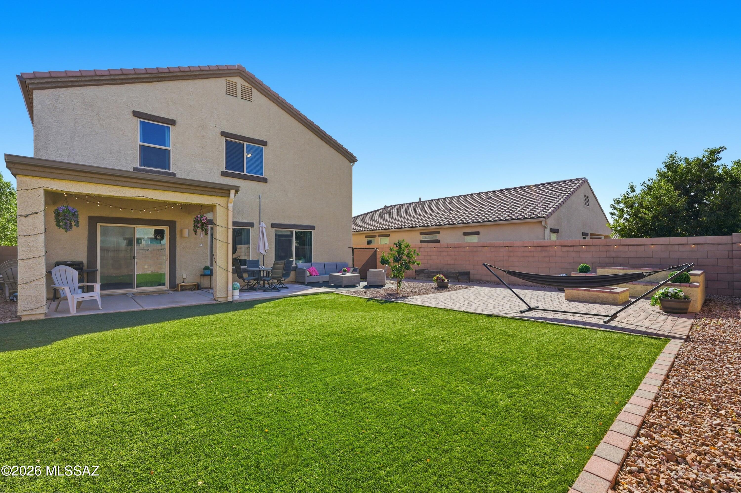 UNBELIEVABLE OFFER!!$10,000 in seller paid concessions to lower your rate/pay closing costs!! AND THATS NOT ALL! We are also lowering our price below market value, & I promise...We are better than new at this price! New builds can't offer a beautifully landscaped back yard w/ turf, pavers, & a beautiful firepit area perfect for entertaining! 
This stunning model-like home impresses inside & out. 4-bedroom PLUS den/5th BD , 2.5-bath home w/ a 2.5-car garage.
The seller has added gorgeous custom upgrades throughout. The immaculate kitchen features granite countertops, shaker cabinetry w/crown molding, tile backsplash, stainless steel appliances, & a spacious island w/ breakfast bar.The enormous primary suite offers a private BA w/ dual vanities & an impressive 20 ft deep closet..see more.. This size home is a rare find in the highly desirable Saguaro Bloom community, offering parks, pool, splash pad, fitness center, recreation center, hiking and walking trails and a true sense of community. Conveniently located just 10 minutes from I-10.
Close to schools, restaurants, shopping, and theaters! 
The offer for $10,000 concessions is based on a full price offer on our new and below market value price! Seller requests that the provided blue "booties" be worn for showings upstairs.