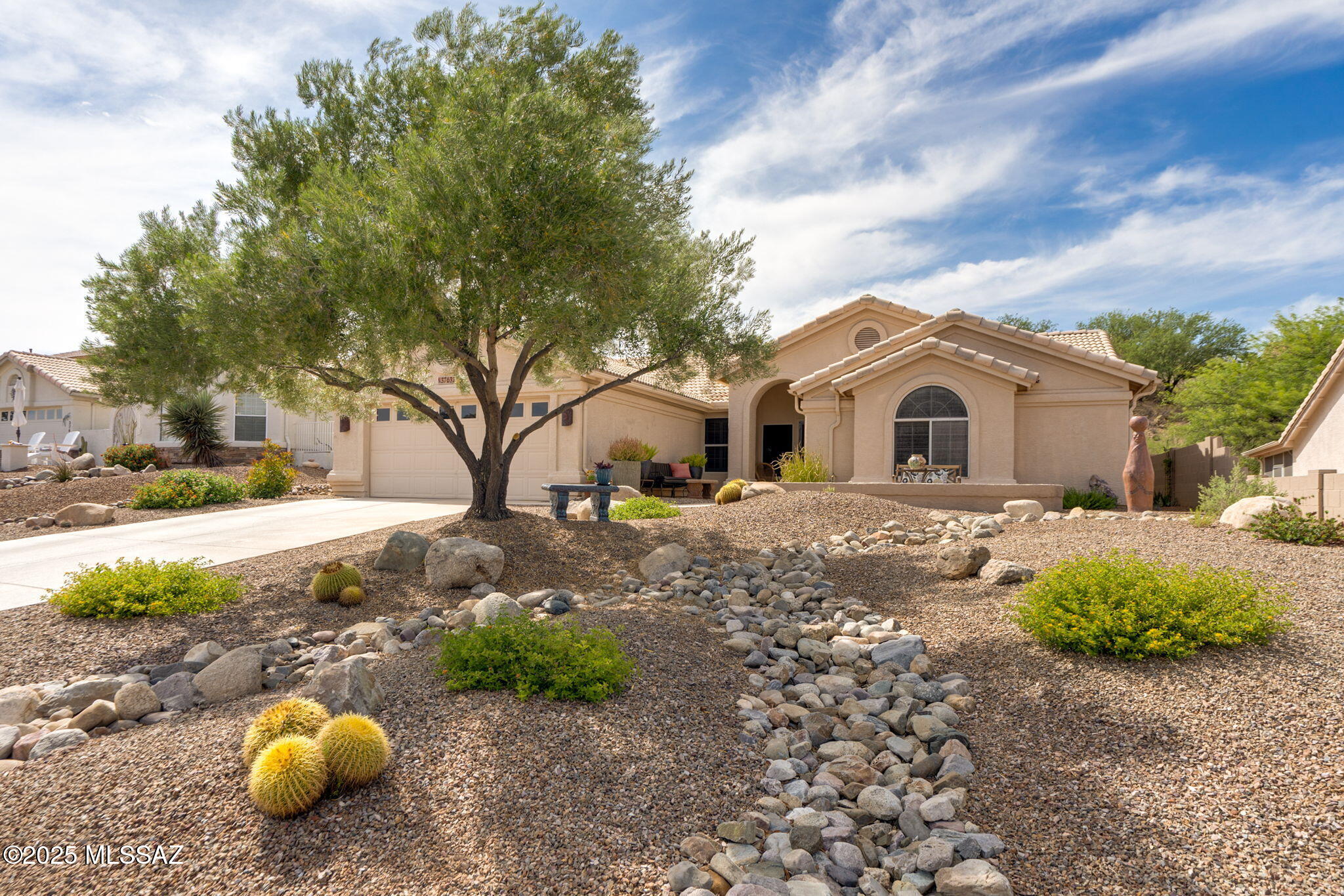 Welcome to this beautifully appointed 2BD/2BA+den Topaz model, offering 2,187 sq ft of stylish living space. Set on a premium lot with open space behind, this home blends comfort, functionality, and serene outdoor living. Step inside to find tile flooring throughout, plantation shutters, and a thoughtfully designed layout perfect for entertaining or relaxing in style.  The chef's kitchen features granite countertops, SS appliances and abundant cabinetry, ideal for culinary enthusiasts. Retreat to Owner's suite with all the modern comforts. Outside, unwind in your tranquil backyard oasis featuring a covered screened patio, elevated 7.5'x13' swim spa with decking. Ideal for peaceful mornings or entertaining under the stars! Located in Saddlebrooke, premier 55+ active adult community.