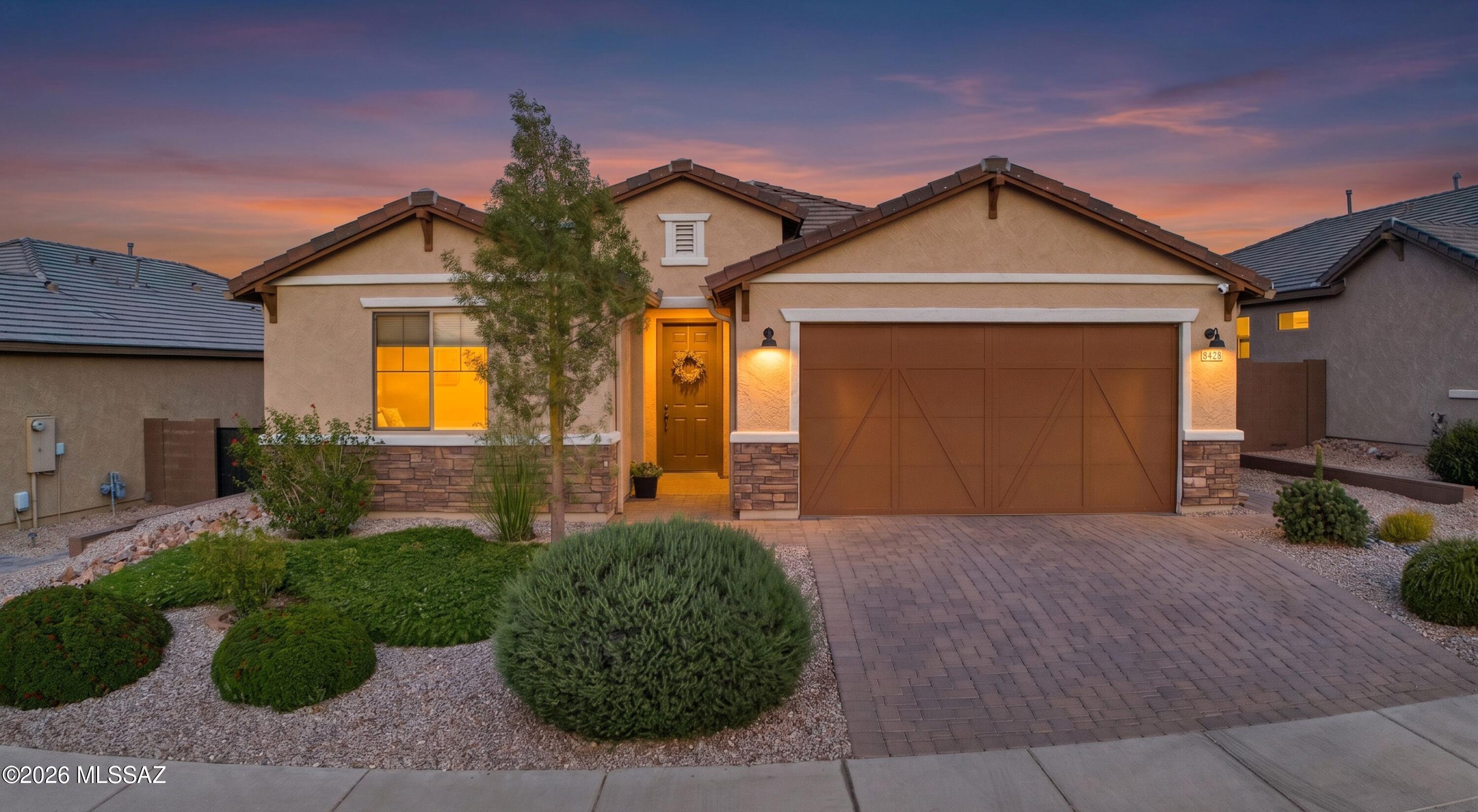Seller will accept or counter offers between $560,000-$590,000. Situated in Lazy K Bar Ranch, a highly sought-after gated community in Northwest Tucson, this home is framed by the dramatic backdrop of Sombrero Peak and sweeping desert views. Built in 2022, this home has been thoughtfully improved with upgrades that add comfort, function, and style. Offering 4 bedrooms, 3 full bathrooms, a den, and a spacious 2-car garage with a 4-foot extension, this split floor plan blends modern finishes, thoughtful design, and a beautiful desert setting. Inside, you'll find upgraded 8-foot interior doors, ceramic tile and luxury vinyl plank flooring throughout, and a well-designed chef's kitchen featuring granite countertops, a stylish backsplash, slate cabinetry, an enhanced island, and an added 3-foot cabinet with butcher block counter. The open-concept layout provides comfortable everyday living and an easy flow for entertaining. The primary suite features a beautifully finished bathroom with a framed walk-in shower, while additional upgrades include laundry room cabinetry, rain gutters, and added insulation in the patio and garage areas. Pride of ownership is evident throughout, with thoughtful upgrades, refined finishes, and low-maintenance landscaping delivering a truly turn-key living experience. The backyard is designed for entertaining with turf, travertine, pavers, and plenty of space to enjoy the surrounding desert and mountain views. Backing to open space, this home offers the privacy, scenery, and Arizona lifestyle buyers are looking for. Schedule your private showing and experience the views, setting, and thoughtful upgrades that set this home apart.