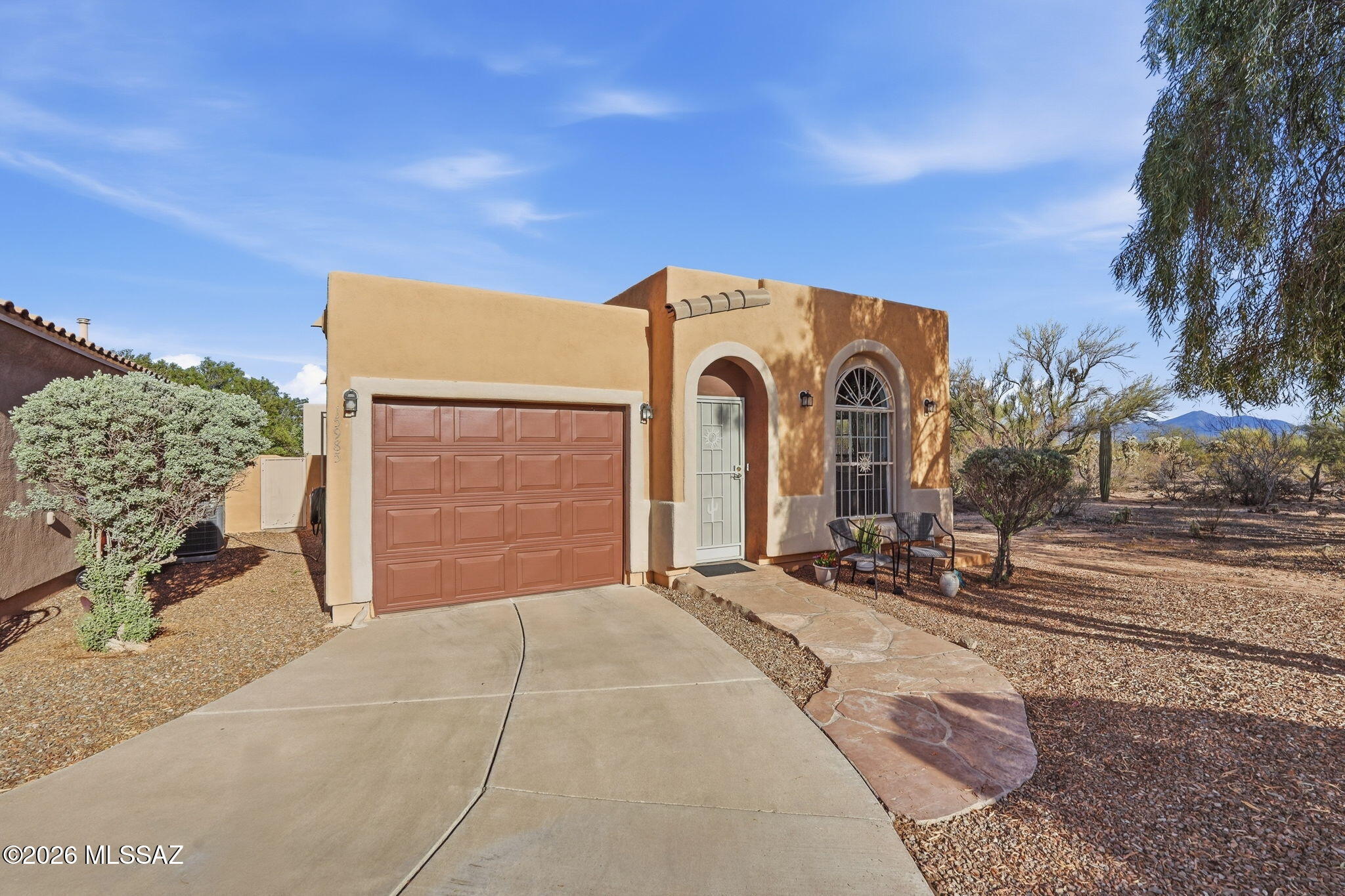 Welcome to gated Rancho Resort™, a premier 55+ gated community in the award-winning Rancho Sahuarita™. This end-unit home features 1 bedroom, 1 bath, plus a versatile den--ideal for a home office or guest space. Enjoy beautiful desert and mountain views from this peaceful setting. Residents have access to a vibrant clubhouse with a ballroom, library, fireside lounge, activity rooms, and village green, along with a variety of social events and amenities. Experience comfortable, low-maintenance living in an active adult community just 20 minutes south of Tucson.