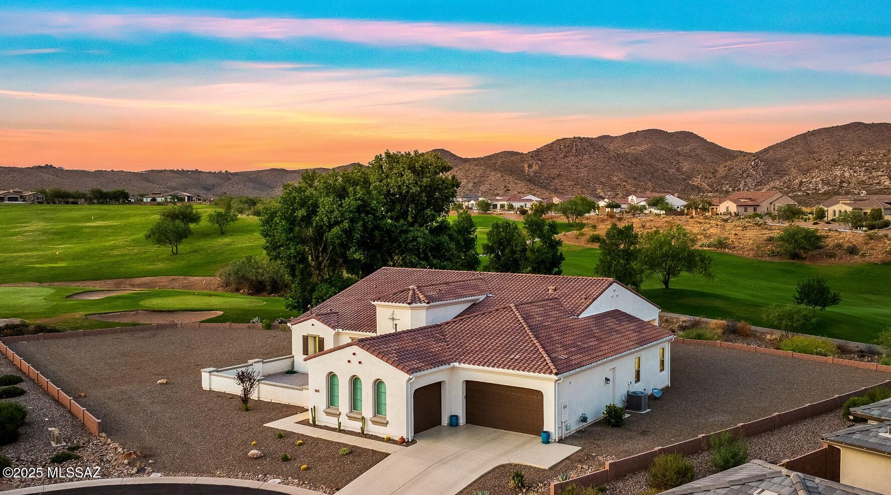 Discover the ultimate blend of elegance, comfort, and breathtaking views in this 3,484sf 2BR/2BA Sonrisa model w/den & bonus room, perfectly situated on a premium .47-acre cul-de-sac pool-sized lot in The Preserve at SaddleBrooke. Built in 2021, this one-story stunner offers sweeping golf course and mountain vistas, a gated front courtyard, features timeless Travertine stone, adding a touch of elegance and sophistication to the home's entrance. Step inside to a grand open-concept floor plan with soaring 10' and 12' ceilings, tile flooring throughout. The spacious Great Room features a tray ceiling, media alcove, walk-up dry bar, and a large sliding glass door that opens to over 690sf of covered outdoor living space, perfect for entertaining or relaxing with a view. The chef's kitchen is with quartz countertops, a grand island, high-end stainless Wolf gas   cooktop, microwave and wall oven, ASKO dishwasher & Sub Zero refrigerator and soft-close Alder cabinetry with pull-out shelves. The walk-in pantry & additional butler's pantry offer storage and functionality, while the adjacent dining area includes its own patio access for seamless indoor-outdoor dining. Retreat to the luxurious Owner's Suite with private patio access, dual walk-in closets with custom built-ins, a spa-inspired bath featuring dual vanities, quartz counters, an oversized soaking tub & tiled walk-in shower with rainfall head & built-in seating bench. A generously sized guest suite includes its own walk-in closet & en-suite bath with a walk-in shower. You'll also enjoy a versatile den, a separate bonus room for hobbies or fitness and a spacious powder room for guests. The large laundry room is fully equipped with wall ironing board, utility sink & cabinetry. The extended 3-car split garage includes a utility sink and extra storage ideal for golf carts, tools or outdoor gear and was recently coated with Polyurea for superior durability & UV resistance. The expansive backyard is a canvas for your dreams, framed by captivating views and endless Arizona skies.