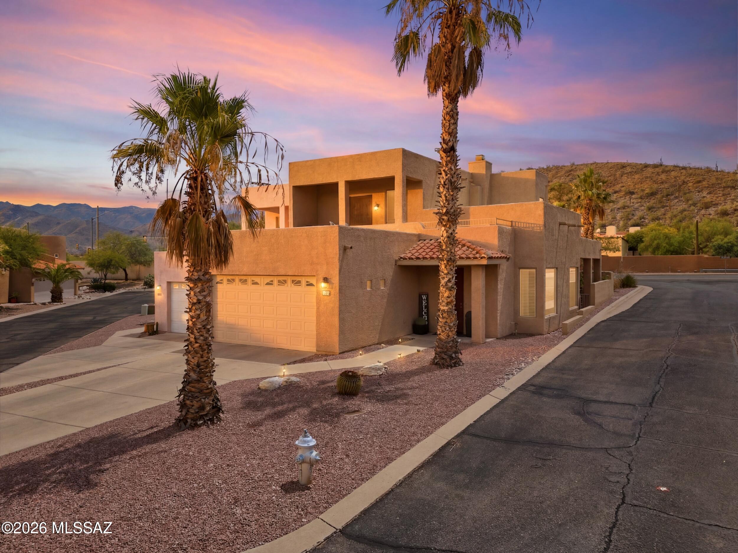 Thoughtfully updated and move-in ready stunning home is situated on a premium corner cul-de-sac lot with breathtaking mountain views right outside your door. Mature palm trees create a resort-like setting, while the interior showcases stained concrete floors, rich cabinetry, stainless steel appliances, and abundant natural light. The kitchen features a custom tile backsplash, center island with breakfast bar, pantry, and dining area. This desirable floor plan offers two spacious primary suites, each featuring custom California Closets. Enjoy the beautifully landscaped backyard with lush green turf, mountain views, and a covered patio, perfect for relaxing or entertaining. Schedule your private showing today!
