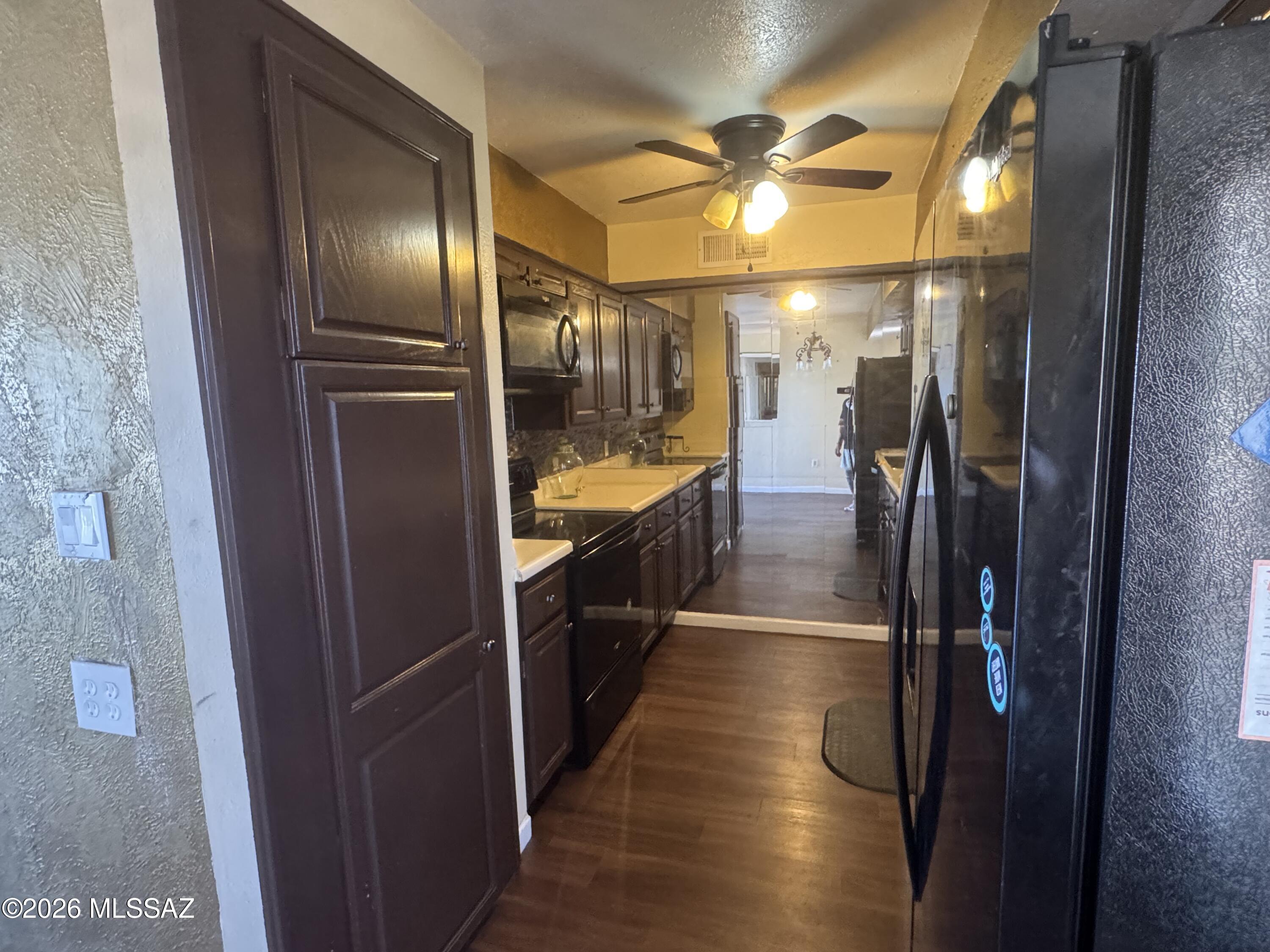 Large 2 bedroom/2 full bathroom condo with kitchen featuring back splash, Black appliances, and cabinets that are in excellent condition. Large sliding glass door out to the patio to enjoy the fresh air. Both large bedrooms have walk in closets. The bathrooms include upgraded vanities and granite. HOA covers the water, trash, sewer bills, exterior Maintenance, Roof & Landscaping. Las Colinas Community offers two pools and three laundry facilities. Buyer must be approved by HOA.