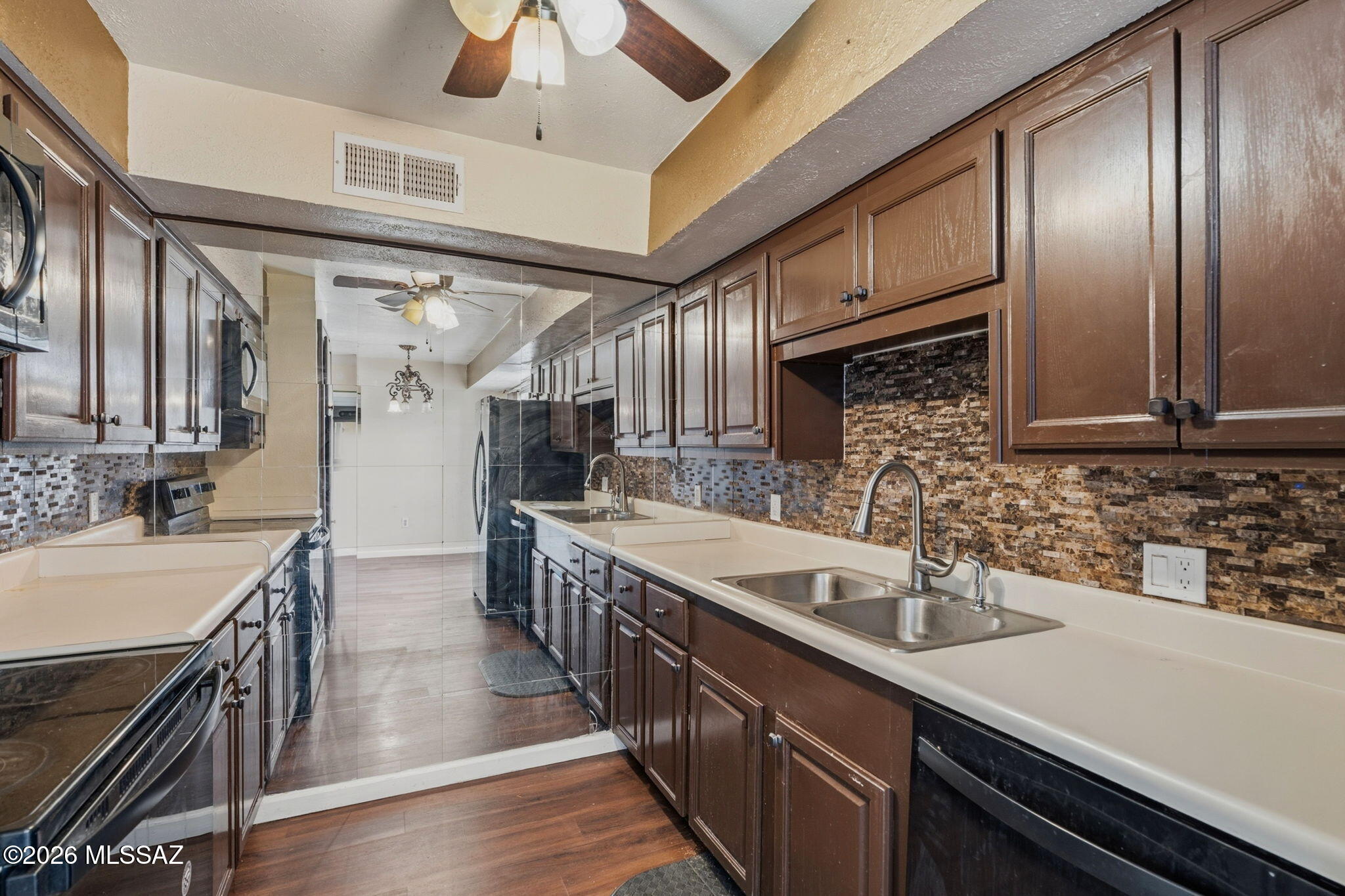 Large 2 bedroom/2 full bathroom condo with kitchen featuring back splash, Black appliances, and cabinets that are in excellent condition. Large sliding glass door out to the patio to enjoy the fresh air. Both large bedrooms have walk in closets. The bathrooms include upgraded vanities and granite. HOA covers the water, gas,trash, sewer bills, exterior Maintenance, Roof & Landscaping. Las Colinas Community offers two pools and three laundry facilities.