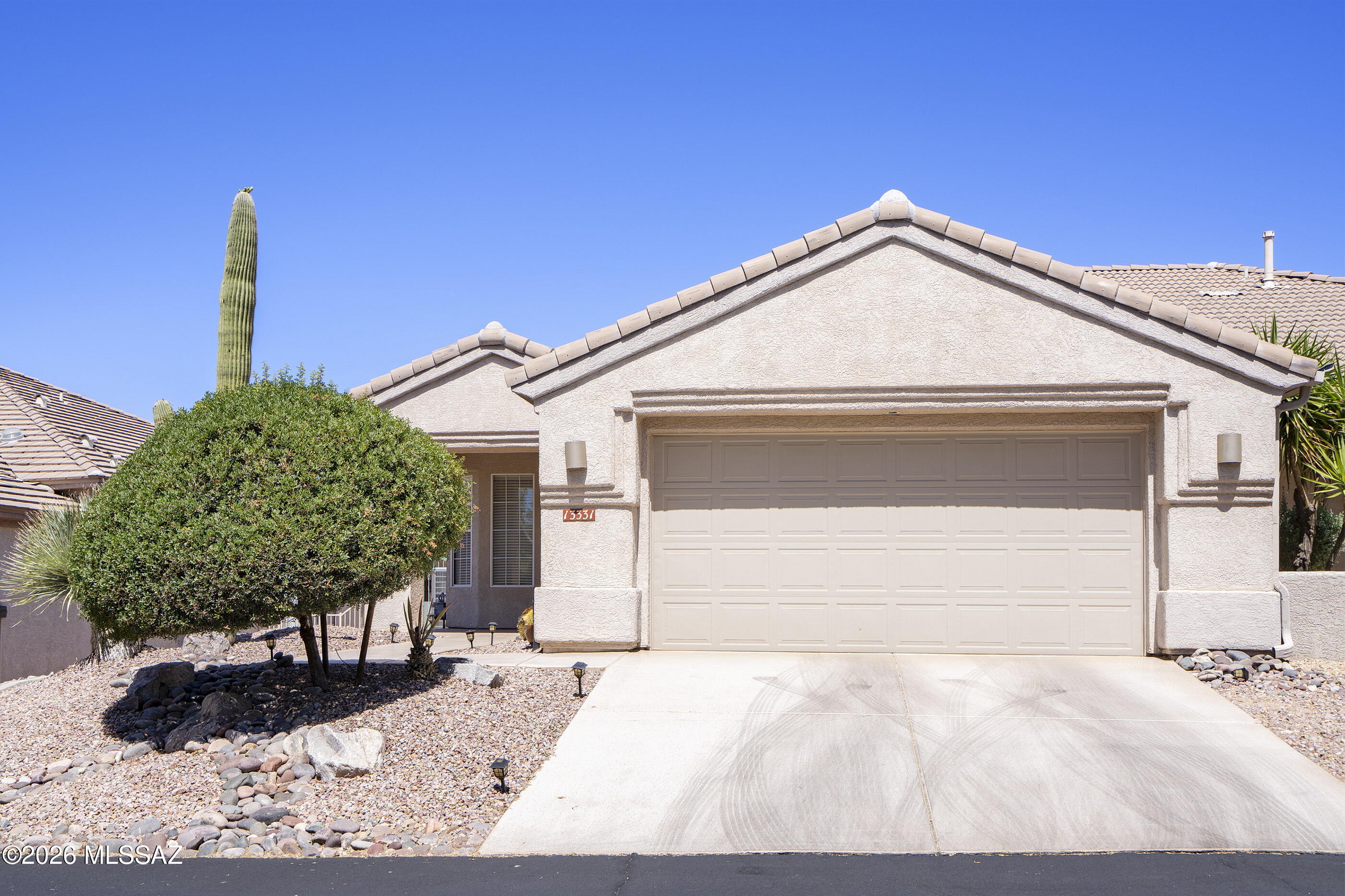 Contemporary home in the guard-gated community of The Highlands, perfectly positioned on a serene lot backing to open space & the golf course w/ stunning Mountain views. Enjoy the golf course lifestyle in this bright, open floor plan featuring a white kitchen w/ granite countertops, pantry, breakfast bar, & sunny breakfast nook w/ bay windows. Spacious great room w/ custom built-ins, fireplace, & dining area. Owner's suite offers tray ceilings, walk-in closet w/ custom built-ins & ensuite bath w/ double vanity & shower. Comfortable guest room & updated guest bath. Private outdoor living includes a screened-in porch, extended brick paver patio, & sweeping mountain & golf course views. Top notch resort-style amenities include golf, pickleball, tennis, pool, spa, gym, & restaurant.