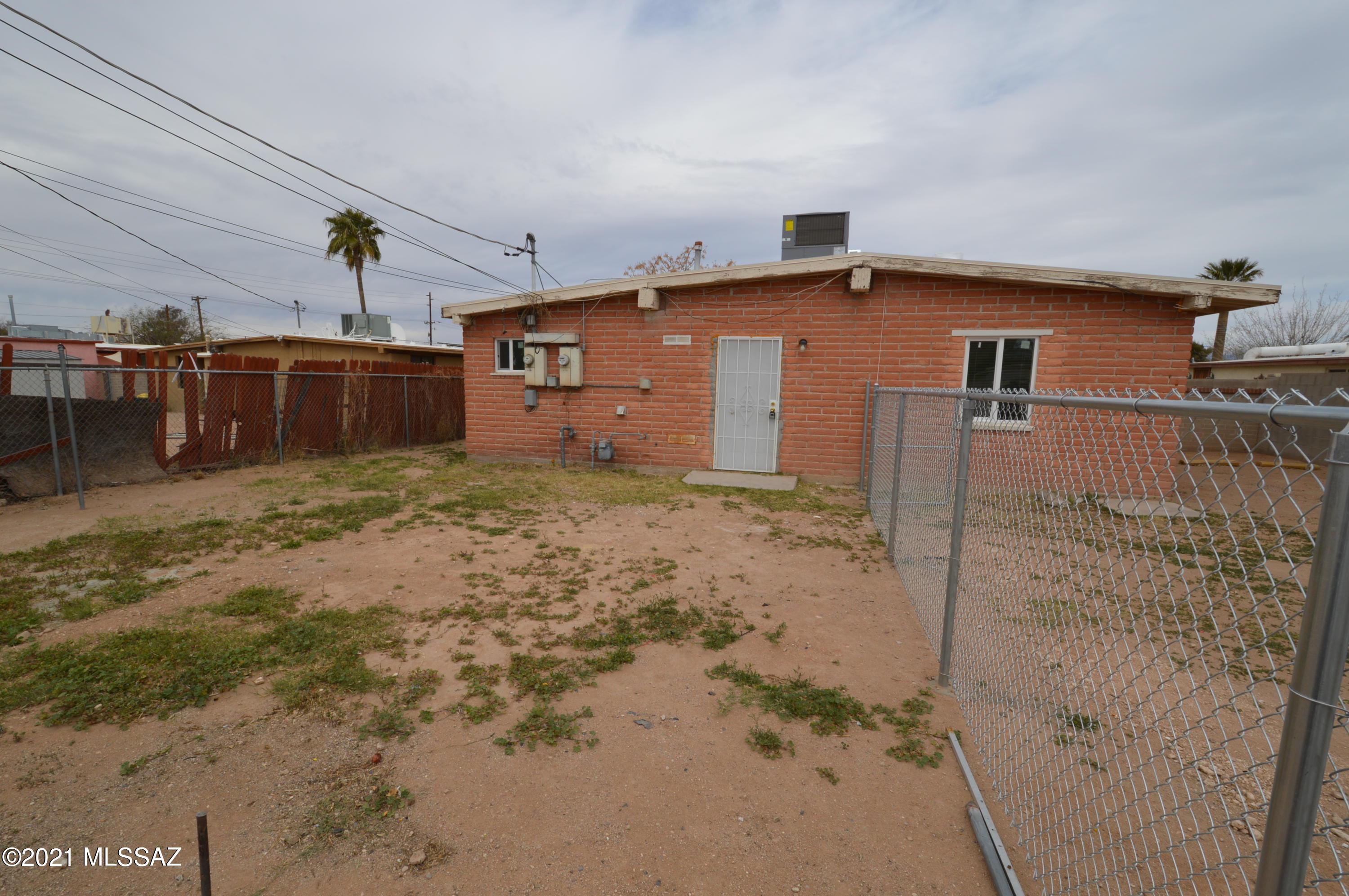 HUGE adobe 2 bedroom. Bright and open living areas and spacious bedrooms. Fenced yard, great for kids or pets. Washer/dryer hookups! CENTRAL A/C! Great access to the interstate and the airport! ACT NOW!! This one won't last!