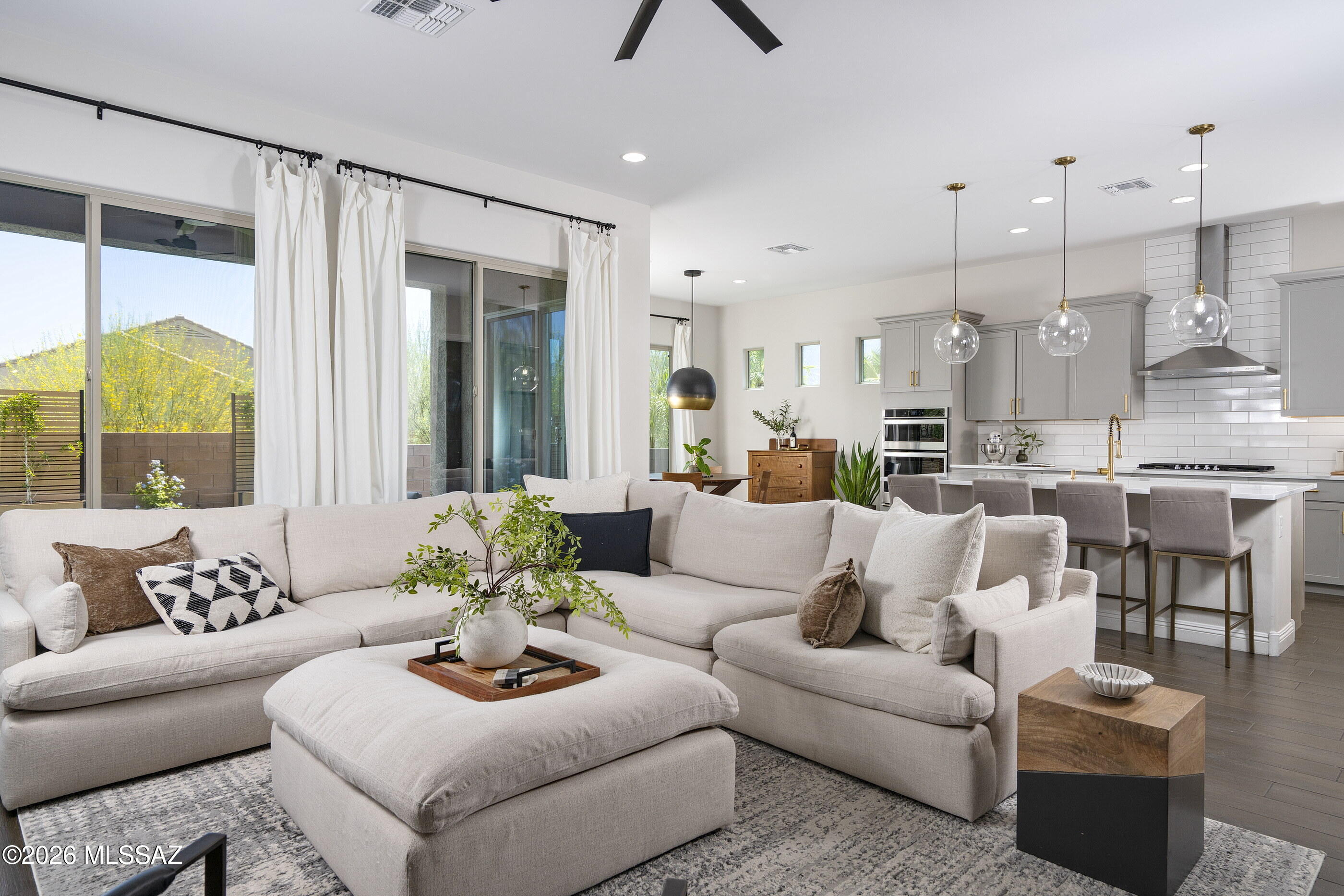 Tucked away on a cul-de-sac in the sought-after Valley Vista neighborhood of Rancho Vistoso, this beautifully appointed Pulte residence offers a seamless blend of comfort, style, and desert serenity. A private courtyard entry sets a welcoming tone, leading into light-filled interiors where soaring ceilings, luxury plank tile flooring, and an open-concept design create an atmosphere that is both sophisticated and inviting. The heart of the home is a spacious kitchen featuring a generous center island, walk-in pantry, and casual dining nook with direct access to the outdoor living spaces. Open to the great room and dining area, it serves as the natural hub for everyday living and effortless entertaining. Thoughtfully designed with a split-bedroom floor plan, the primary suite occupies its own private wing, offering a peaceful retreat complete with a spa-like bathroom, quartz countertops, walk-in shower, and expansive closet. On the opposite side of the home, three additional bedrooms provide flexibility for family and guests, including a private en-suite bedroom and a versatile bonus space ideal for a home office, media room, or fitness studio.

Outdoors, the backyard showcases the beauty of the surrounding landscape while providing generous space for a future pool, sports court, or customized outdoor retreat. A covered patio extends the living experience outdoors, where sweeping mountain views provide a stunning backdrop for morning coffee, evening sunsets, and gatherings around the fire pit. Low-maintenance and thoughtfully designed, the outdoor spaces invite year-round enjoyment of Southern Arizona's exceptional climate.

Combining modern comfort with a coveted Rancho Vistoso setting, this residence offers an elevated lifestyle in one of Oro Valley's most desirable communities.