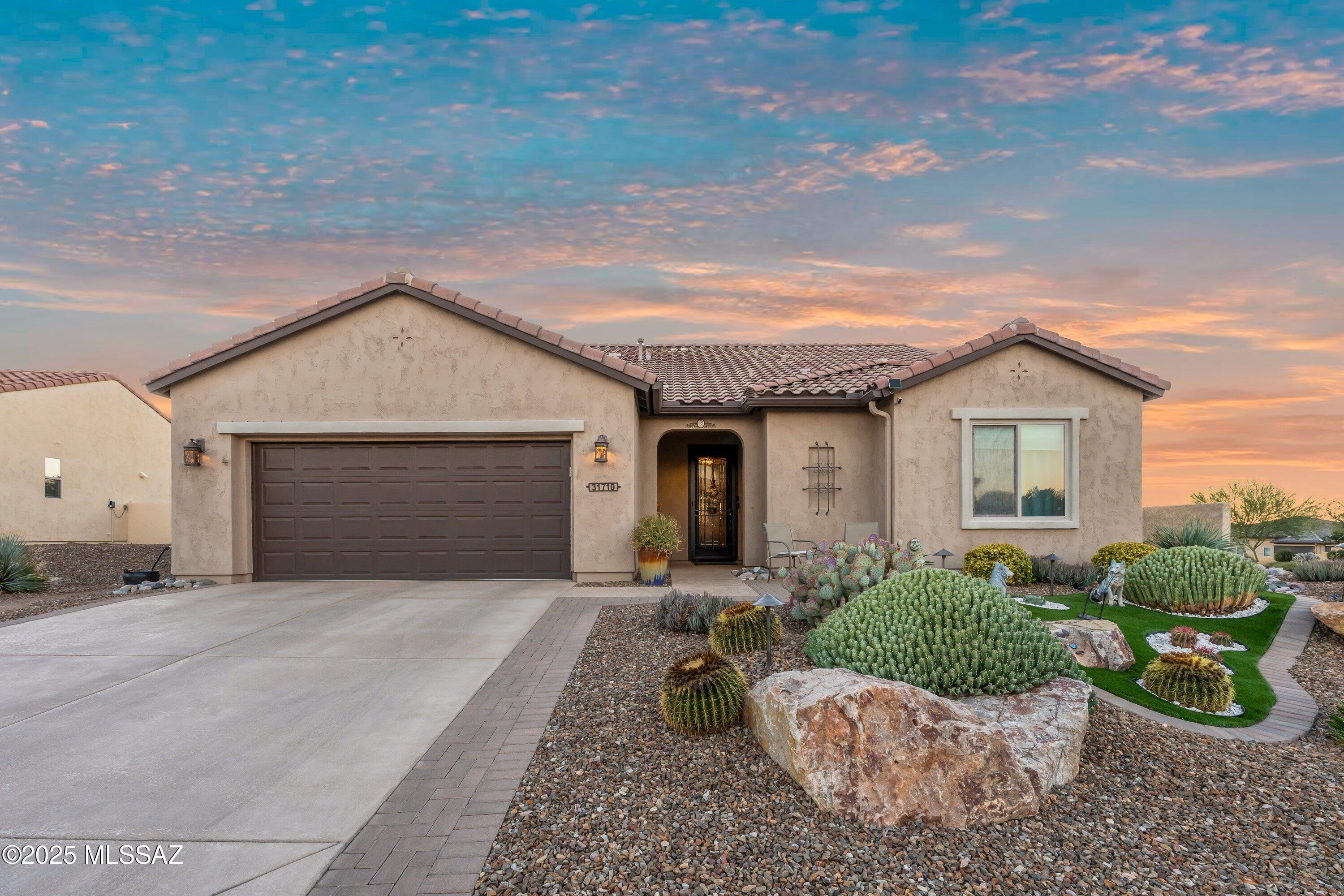 Discover the charm and functionality of this beautifully appointed Artesa model, which can be purchased fully furnished as a turnkey opportunity! Nestled on an upgraded corner lot, within walking distance to the community amenities. The home offers exceptional privacy with a fully-fenced backyard professionally designed by Creative Architecture Landscaping, adorned w/fruit trees & distant mountain views. Outdoor living is elevated with a covered screened patio with fire table, an extended paver patio, a lighted pergola complete with misters, along with a solid side wall to block any traffic noise--perfect for relaxing or entertaining. The gourmet kitchen showcases Slate appliances, gas range, pendant lighting, under-cabinet illumination, a Blanco sink, trash pull-out drawer, pantry closet,