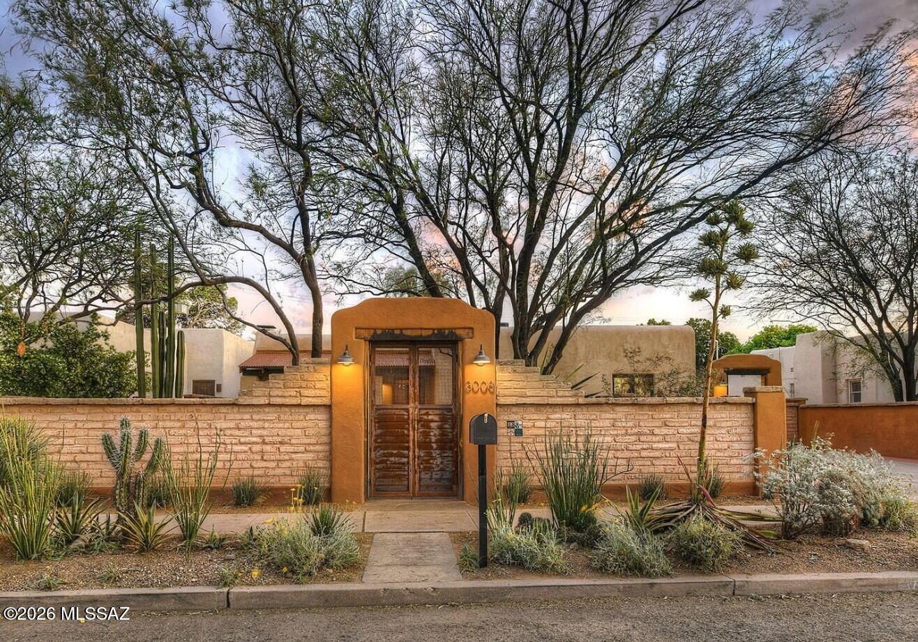 In historic Blenman Elm neighborhood this beautiful home is a true Old Sonoran home. Full of timeless charm with adobe accents. Courtyard entry and separate guest house. Chef's style kitchen. Centrally located, close to U of A, Banner Hospital and more