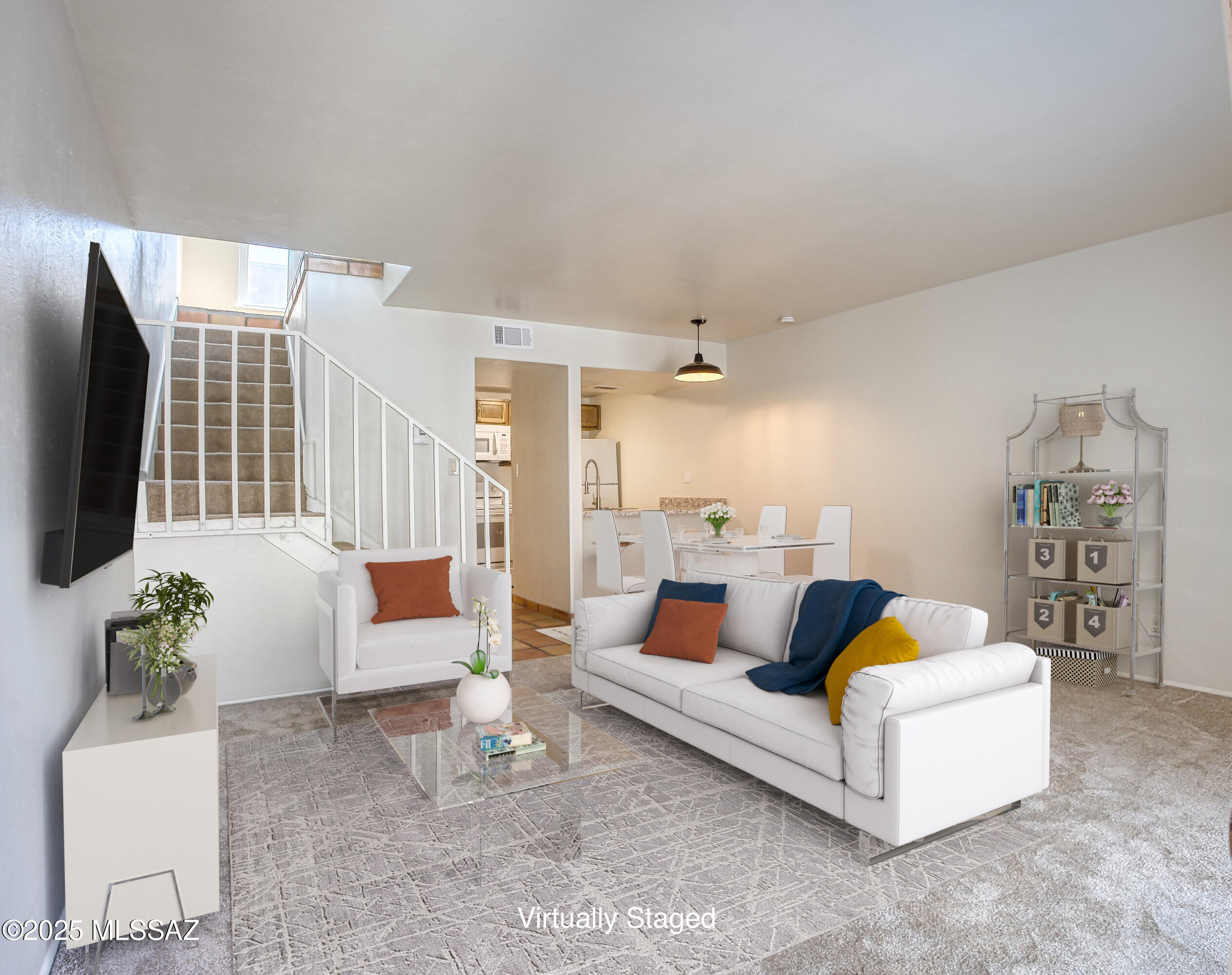 Freshly updated 1-bedroom, 1.5-bath loft-style condo in the Las Colinas community. This two-story unit features brand new carpet on the main floor, new kitchen cabinets, countertops and microwave. Additional updates include cabinetry in both bathrooms, dual-pane windows, patio door and HVAC system. The open layout includes vaulted ceilings, Saltillo tile, and great natural light with Catalina Mountain views.Las Colinas offers two pools and three laundry facilities. HOA covers water, sewer, trash, and pest control.Convenient location near shopping, dining, medical, and public transit. *Rentals Permitted