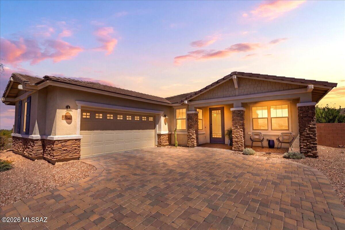 Nestled on a private corner lot in the gated Dove Mountain community, this beautifully maintained home features brand-new carpet in both bedrooms and stunning Tortolita Mountain views. The open floor plan offers 2 bedrooms plus a den/office, high ceilings, abundant natural light, and a spacious great room. The kitchen includes granite countertops, stainless steel appliances, a gas range, walk-in pantry, and large island. Enjoy your private backyard retreat with mountain views, low-maintenance desert landscaping, and a covered patio. Additional features include a water softener, reverse osmosis system, epoxy-coated garage floor, paver driveway, and ample storage. Conveniently located near pickleball courts, a dog park, walking trails, and championship golf courses.