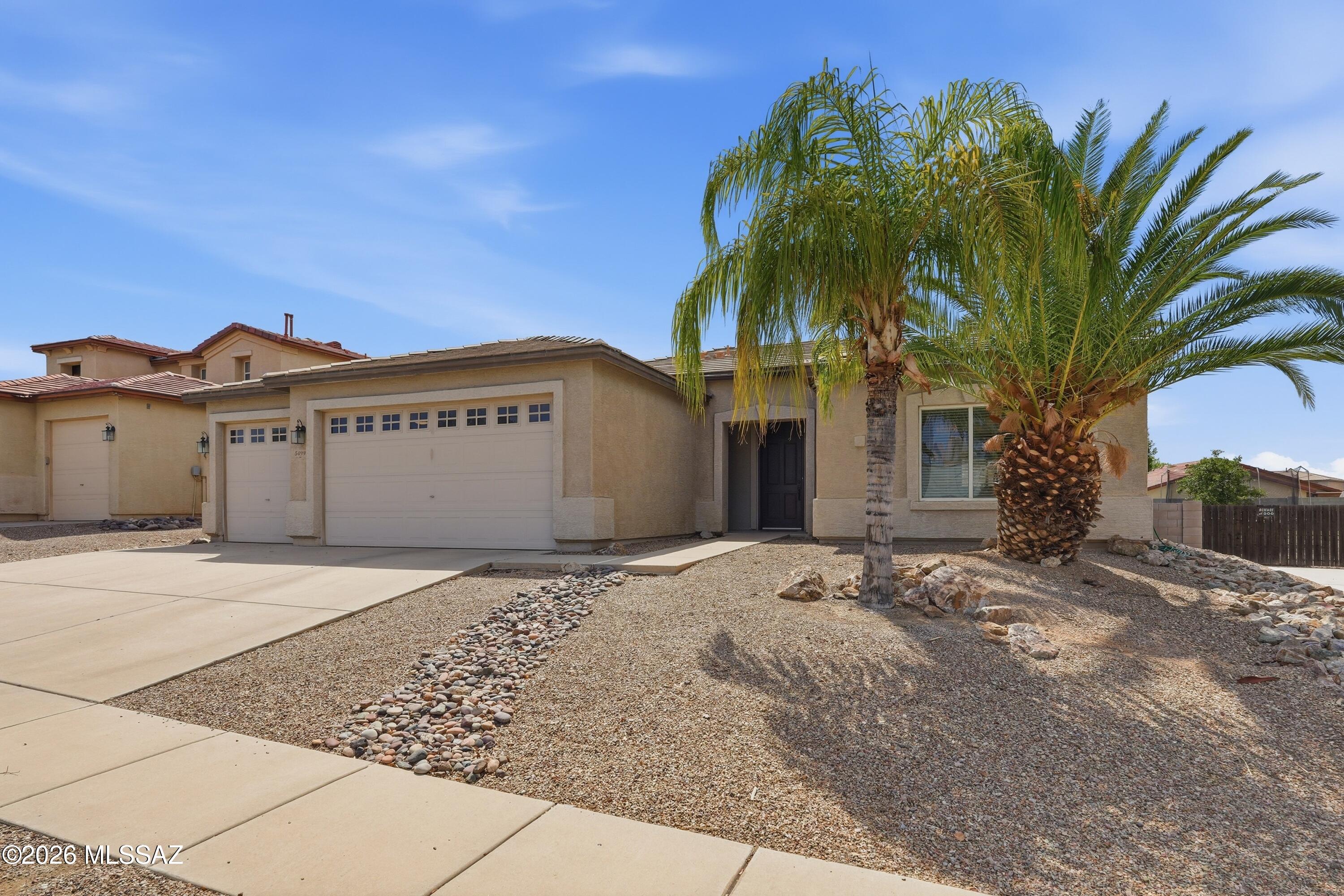 Beautiful 2005 KB built single-story home in the desirable Hartman Vistas community of NW Tucson! This spacious 2,045 sq. ft. floor plan offers 3 bedrooms, 2 bathrooms, plus a generous den for office or guest room space.The open-concept design features travertine tile throughout the main living areas, granite countertops in both the kitchen and bathrooms. Large Chef's kitchen w/ center island,newer SS appliances & custom cabinetry.The oversized 3-car garage provides ample room for vehicles, storage, or hobbies. All apliances convey, New HVAC 2026, Water Heater 2025.Step outside to a beautiful large backyard with a sparkling pool, creating the perfect space for relaxing or entertaining. Conveniently located near schools, shopping, restaurants, and with multiple easy access to I-10.