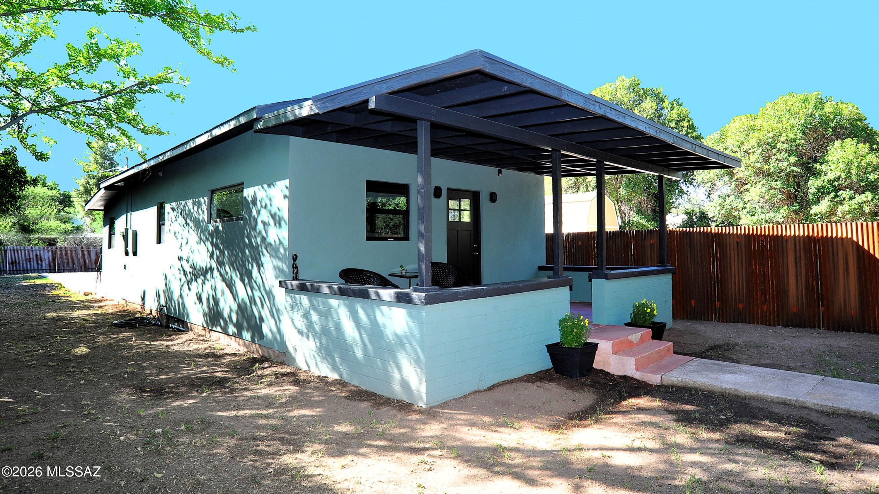 Steps from the Paton Center for Hummingbirds and easy walk to downtown Patagonia, this rare double-lot property blends lifestyle and income potential in one of Southern Arizona's most desirable destinations. Rare flexibility: purchase the lots together or separately. Lot A is offered at $289,900 and Lot B at $150,000.

Lot A features a fully remodeled, turn-key 2 bed/2 bath home with high ceilings, new flooring, Milgard windows, new water heater, and upgraded insulation, plumbing, and electrical - ready to generate income day one. 

Lot B adds immediate value with two large RV pads, each with separate electric and sewer hookups, plus a 192 sq ft shed ideal for a studio or storage. 

Located at 4,000 ft in the Santa Cruz Valley--just over an hour from Tucson--Patagonia offers cooler temperatures, lush creekside scenery, and a lifestyle that makes it one of Southern Arizona's most sought-after destinations.