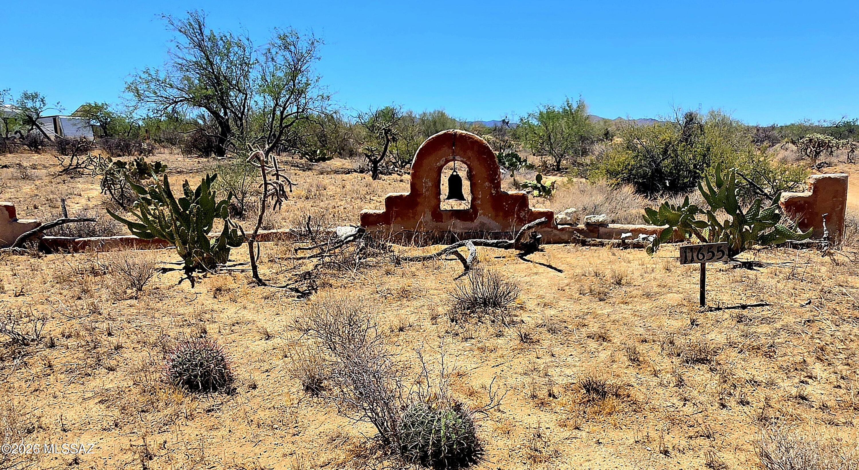 Awesome opportunity to own a custom built OFF-GRID strawbale homestead! Exceptional quality w/ detached 1000 + sq ft workshop/greenhouse/barn encompassing 12-14 ft high ceiling with loft and partially built kitchen/bath. Sweeping views from wrap -around covered porches. 11000-gallon rainwater collection system along with 7KW photovoltaic system make for highly efficient truly sustainable living. Creative and artsy interior boasts concrete floors, copper sinks, copper pot rack with copper pots included along antique working stove,and full-size fridge. Cozy and inviting bath w/ claw foot tub/shower, Extra-large Master Br that invokes a peaceful and serene setting, perfect to ponder and gaze outdoors leading out to fully fenced rear yard and gorgeous sunset views. Many furnishings remain. Additional professional photos to follow along with additional amenities and descriptions.