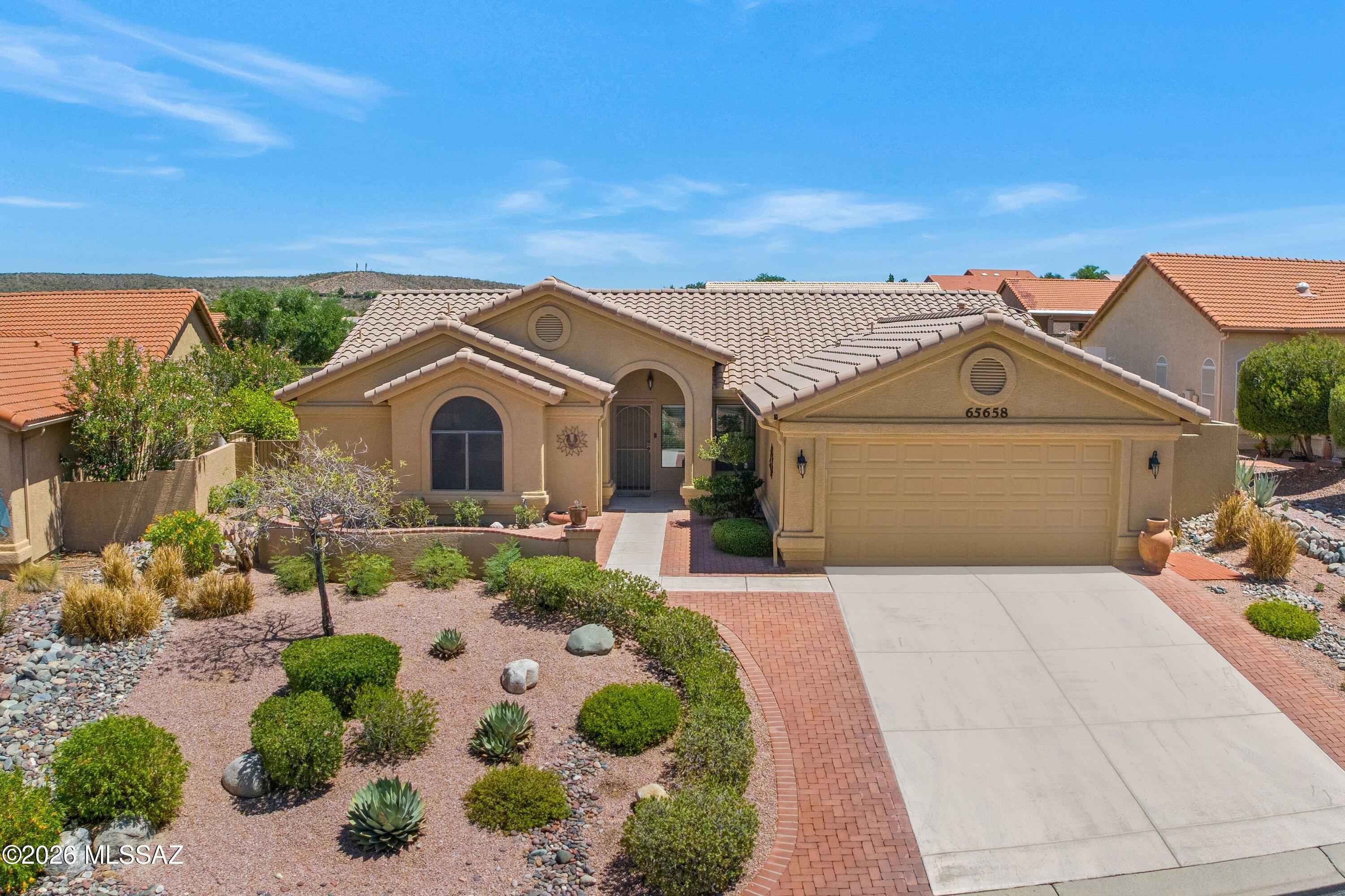 Updated Topaz with Heated Spool! Front courtyard with mountain views & great curb appeal. Exterior painted in 2025 & freshly painted interior in June 2026. Great Room features gas fireplace & patio slider. Kitchen offers granite counters, gas range, stainless appliances, cabinets, solar tube & breakfast nook. Owner's Suite has updated en-suite bath with custom walk-in shower & custom-organized walk-in closet. Guest Bedroom features a Murphy Bed system & closet. Guest Bathroom with solar tube nearby. Laundry Room has 2025 W/D, sink, & cabinets. Included: Aqua Sana whole-house water system. 2-Car Garage has 2018 HVAC, 2025 W/H, cabinets, & side door. Outdoor Oasis has covered patio, pergola, built-in BBQ, soothing water feature, spool with jets, fruit trees, lovely landscaping, & gated yard!
