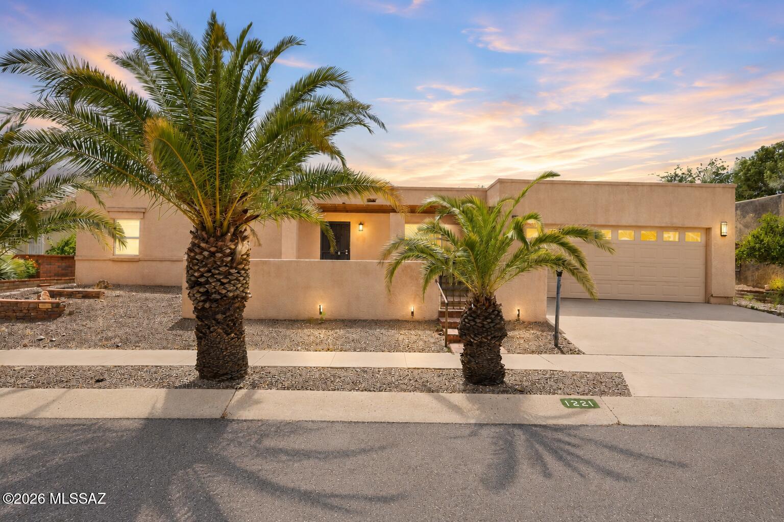 Welcome to 1221 N Avenida Canon Del Cajon, nestled in the heart of Green Valley and offering access to Green Valley Recreation amenities. This charming home is ideal as a winter retreat or year-round residence. A welcoming front courtyard framed by beautiful palm trees creates outstanding curb appeal and a warm Arizona welcome. Inside, you'll find a spacious floor plan featuring a bright and inviting Arizona Room, perfect for enjoying the desert lifestyle and abundant sunshine. The generously sized laundry room offers exceptional flexibility with ample storage, hobby space, and a mini-split system for added comfort. The guest bedroom includes a convenient Murphy bed, making it ideal for visitors while maximizing usable space. Enjoy the privacy of no rear neighbor. HOA $35 per year.