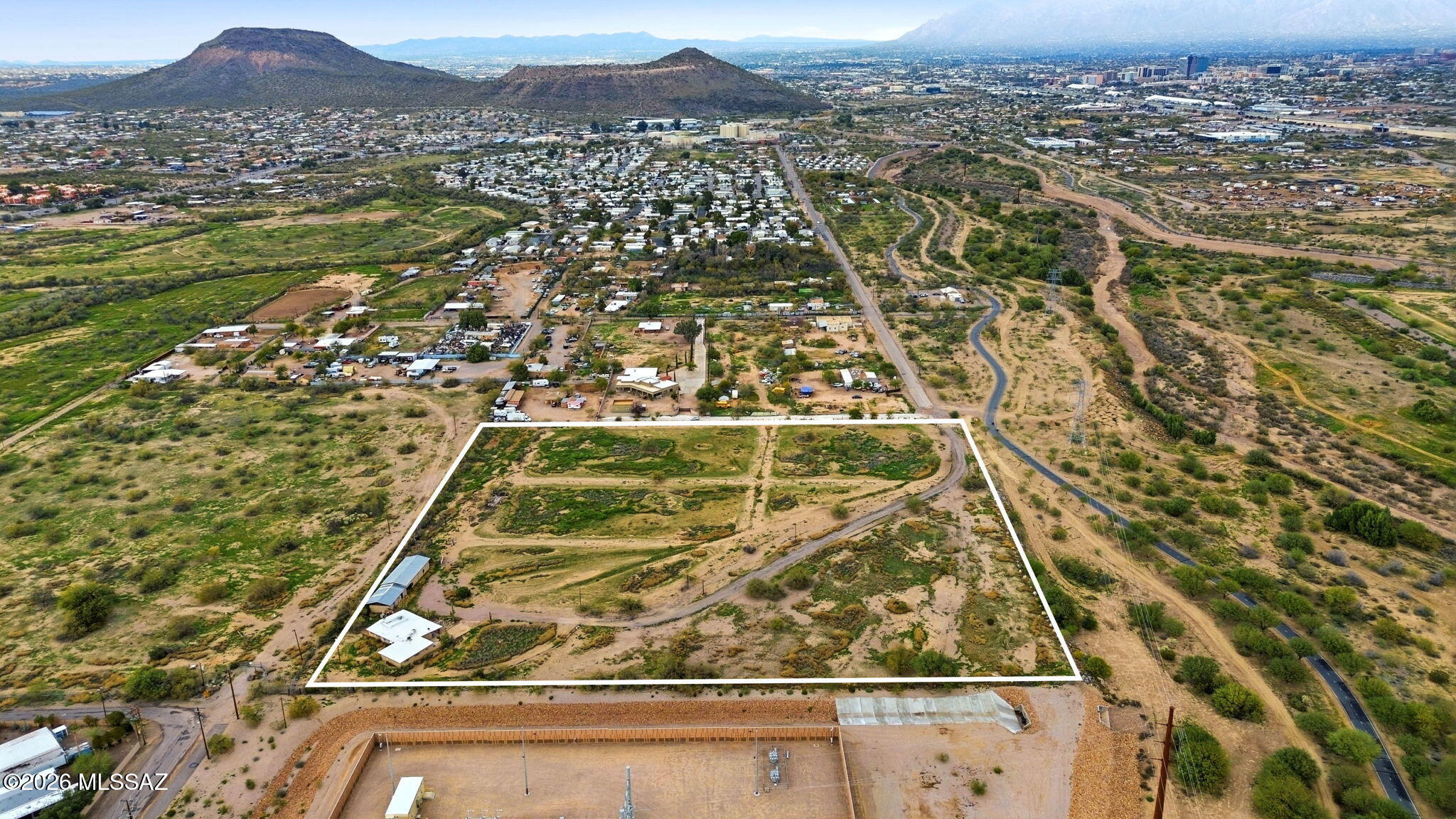 Rarely does an opportunity of this scale, location, and flexibility become available. Encompassing ±10.28 acres with direct frontage along the Santa Cruz River and The Chuck Huckelberry Loop--Tucson's celebrated 137+ mile paved trail system--this is one of the largest near-core riverfront land holdings currently available in the market.

Strategically positioned just minutes from Downtown Tucson, the Mercado District, I-10, and I-19, the property offers a unique combination of accessibility, visibility, privacy, and long-term potential. Access is available from both Silverlake Road and Ajo Way.

The seller is prepared to work with qualified buyers and will consider a traditional sale, lease, option structure, owner carryback financing, joint venture discussions, or other creative term The site presents a compelling canvas for a wide range of potential visions, including a private ranch or equestrian estate, boutique residential community, ranchettes, RV or manufactured housing project, self-storage facility, recreational retreat, corporate compound, or other innovative development concepts. An existing well is located on-site (condition unknown).

Surrounded by mountain views, riverfront scenery, and immediate access to one of Southern Arizona's premier recreational corridors, this is the type of asset that becomes increasingly difficult to replace as Tucson continues to grow and infill opportunities diminish.