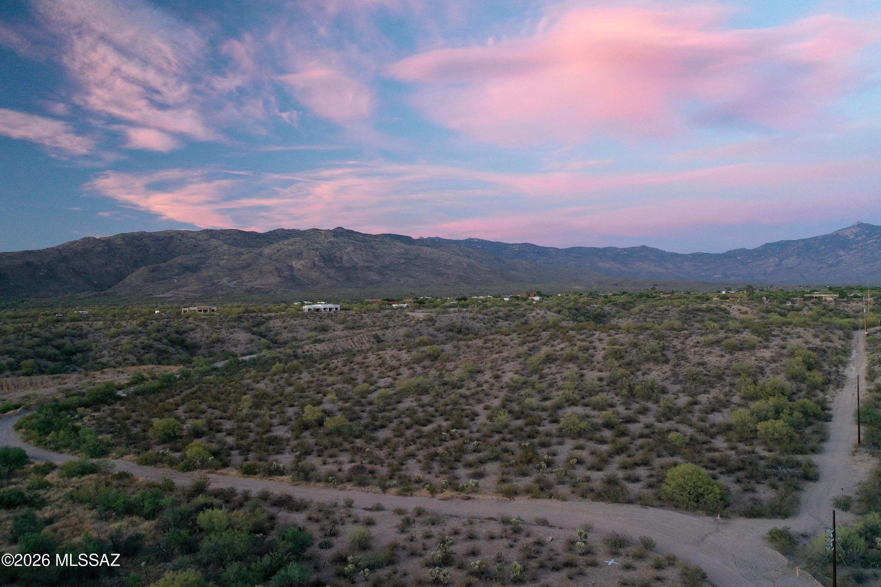 Excellent land opportunity in the rapidly growing Rincon Valley area! This 11.78-acre parcel is zoned SR, with a minimum lot size of 3.31 acres per Pima County zoning, offering excellent development potential. The east portion of the property sits atop a hill with breathtaking panoramic views of sunrises, sunsets, mountains, and city lights. Build your dream home and enjoy the privacy of a large parcel, or explore development possibilities. Utilities nearby include power lines along the south end of the property and water is available. This property would also make an excellent horse property with plenty of nearby riding areas.