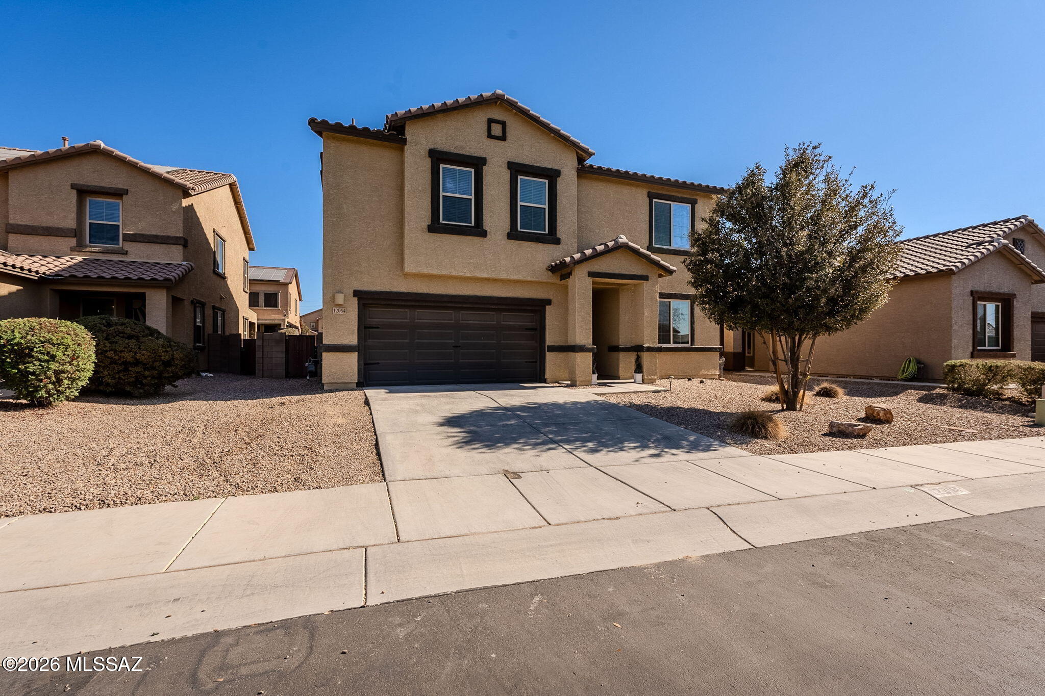 Welcome to a stunning two-story home in the highly sought-after Gladden Farms Community of Marana, AZ.  This pristine 2,774 sq ft Lennar ''Ironwood'' floor plan features 4 bedrooms with a large loft upstairs, 3 full bathrooms and a half bath, a 3-car garage, and fully paid-off solar panels that keep your electric bills incredibly low year-round.