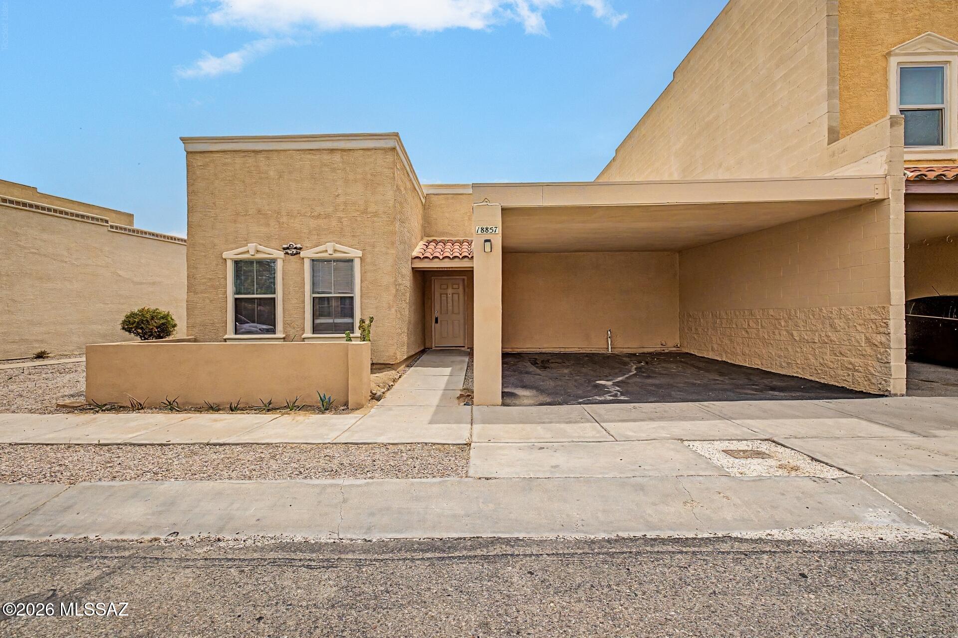 Visit this move-in ready 3-bedroom, 2-bath townhome in desirable Santa Rita Villas! Freshly painted interior throughout, this home features a spacious living room that's perfect for relaxing or entertaining. The fully appointed kitchen offers abundant cabinetry, beautiful new quartz countertops, and ample workspace for meal preparation. Just off the kitchen, you'll find a convenient laundry room complete with a washer and dryer. Step outside to enjoy the private, cozy patio, plus the convenience of a 2-car carport. Residents also have access to the community center and sparkling swimming pool, making this a wonderful place to call home!