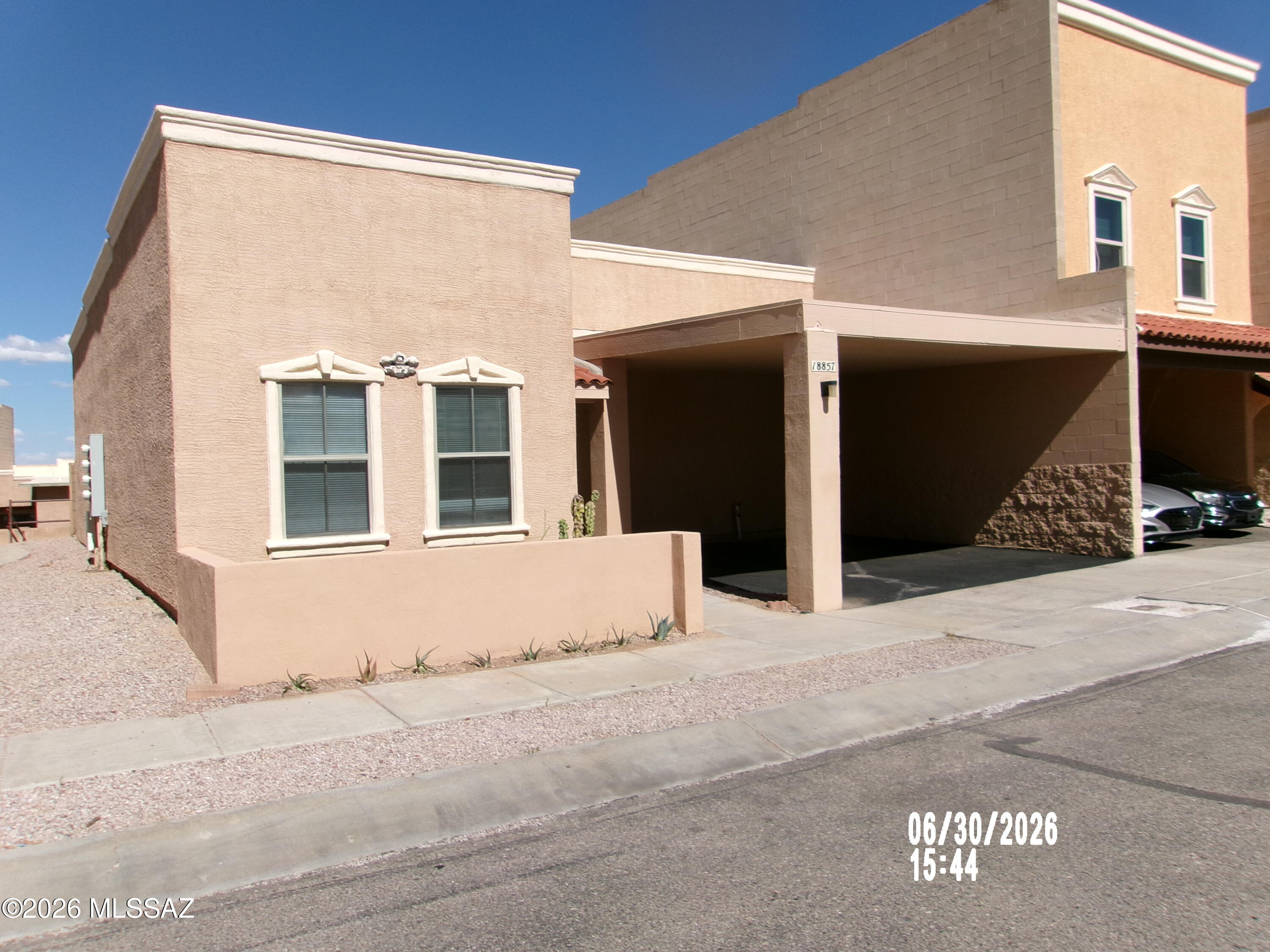 Visit this move-in ready 3-bedroom, 2-bath townhome in desirable Santa Rita Villas! Freshly painted interior throughout, this home features a spacious living room that's perfect for relaxing or entertaining. The fully appointed kitchen offers abundant cabinetry, beautiful new quartz countertops, and ample workspace for meal preparation. Just off the kitchen, you'll find a convenient laundry room complete with a washer and dryer. Step outside to enjoy the private, cozy patio, plus the convenience of a 2-car carport. Residents also have access to the community center and sparkling swimming pool, making this a wonderful place to call home!
