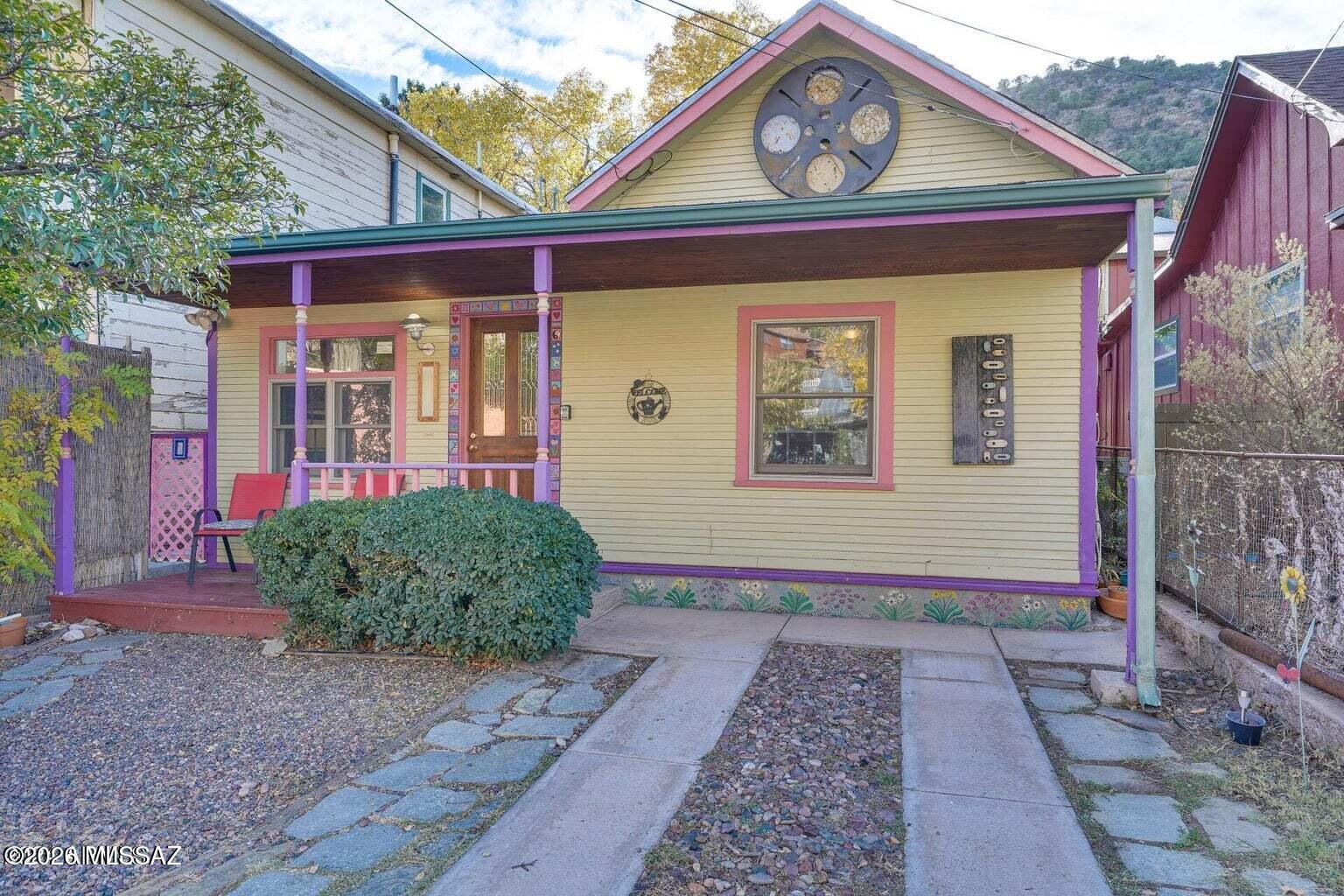 Welcome to one of the most charming properties in the heart of beautiful Old Bisbee!
This thoughtfully updated historic home features a spacious main residence and a separate guest cottage, creating endless possibilities for guests, extended family, a private office, artist's studio, rental income, or simply additional living space.
Perfectly positioned just moments from Bisbee's beloved restaurants, galleries, shops, and live music venues, the location is truly exceptional. Leave your car parked and enjoy the unique lifestyle that makes Old Bisbee so special.
A tranquil private courtyard creates a peaceful connection between the main home and the cottage, offering an inviting outdoor space for relaxing, entertaining, or enjoying Bisbee's beautiful weather. spacious bedrooms, one bathroom, a dedicated laundry room, and a bright, open living and kitchen area filled with natural light. The detached guest cottage offers approximately 325 square feet of additional living space, complete with its own kitchen, bathroom, and private yard.
Private off-street parking for two vehicles is a rare and highly desirable amenity in Old Bisbee. Combined with the property's outstanding condition, recent upgrades, and prime location, this home offers a unique opportunity to enjoy the very best of Bisbee living.
Tucked away just enough to provide peace and privacy, yet close to everything, this special property captures the charm, character, and convenience that make Old Bisbee such a treasured destination.

Welcome home to one of the sweetest and most versatile properties in Old Bisbee.